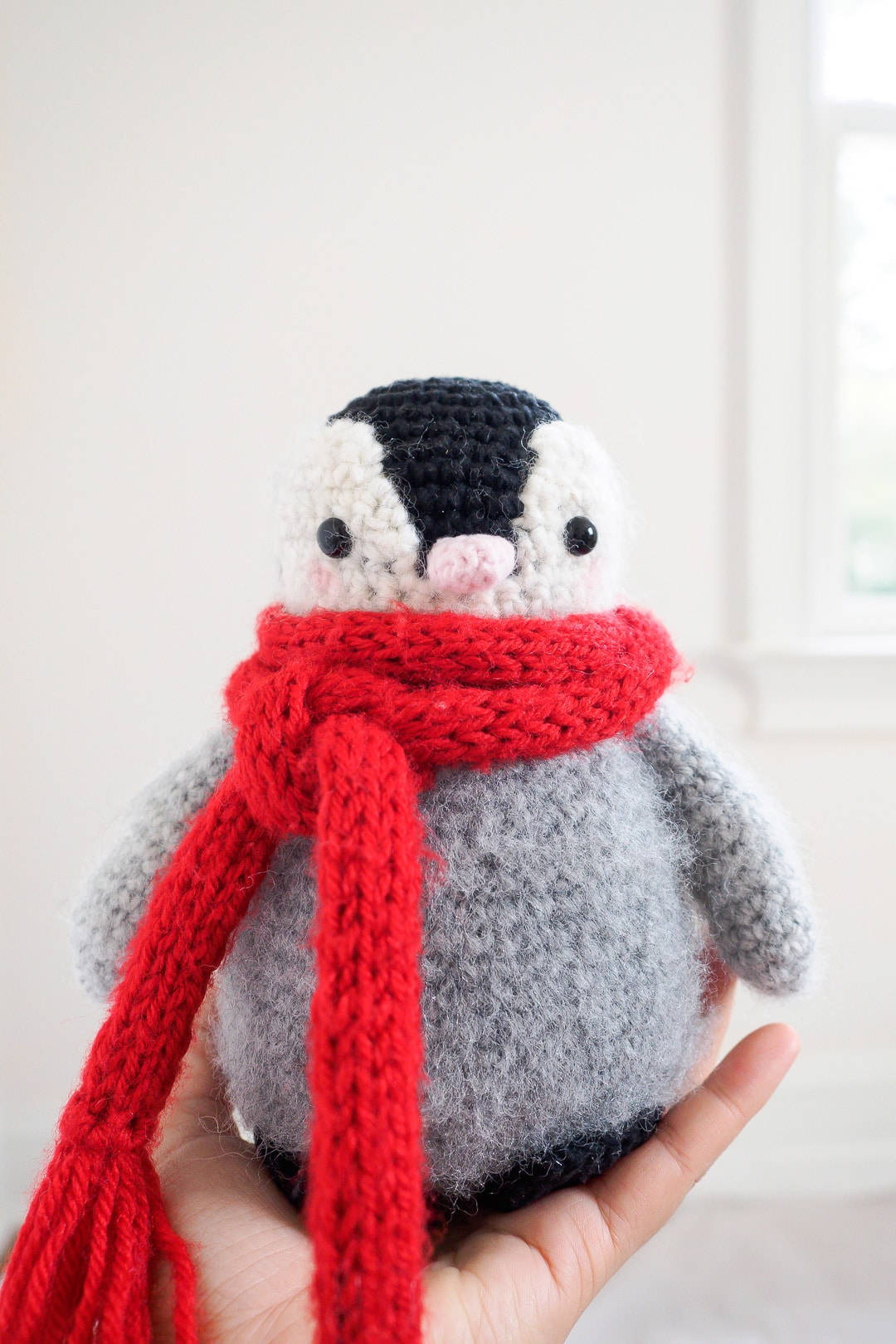 crocheted baby penguin, bright red knitted scarf, soft white background, HD Phone Wallpaper