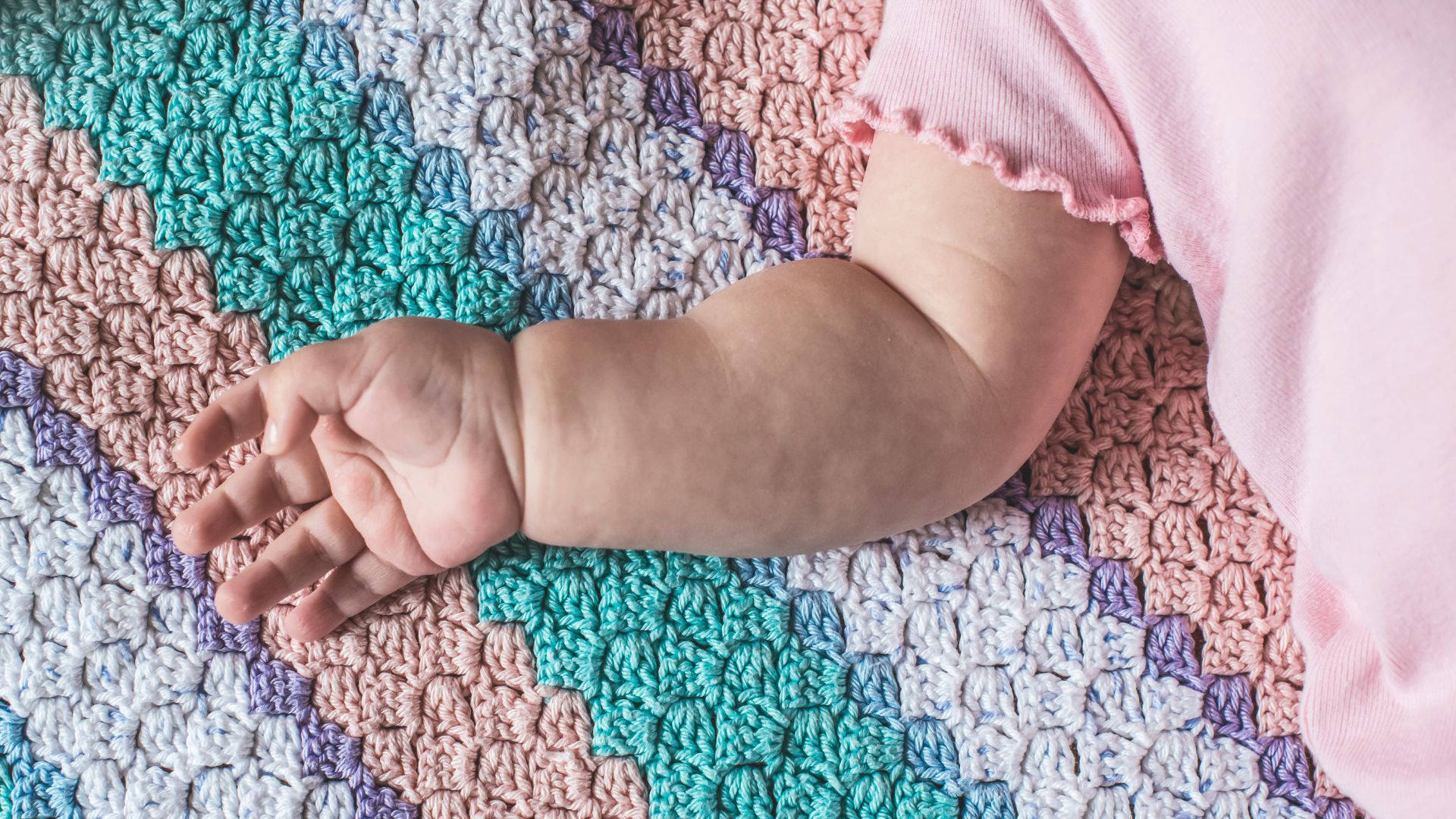 baby hand, colorful crocheted blanket, soft pastel hues, Full HD Desktop Wallpaper