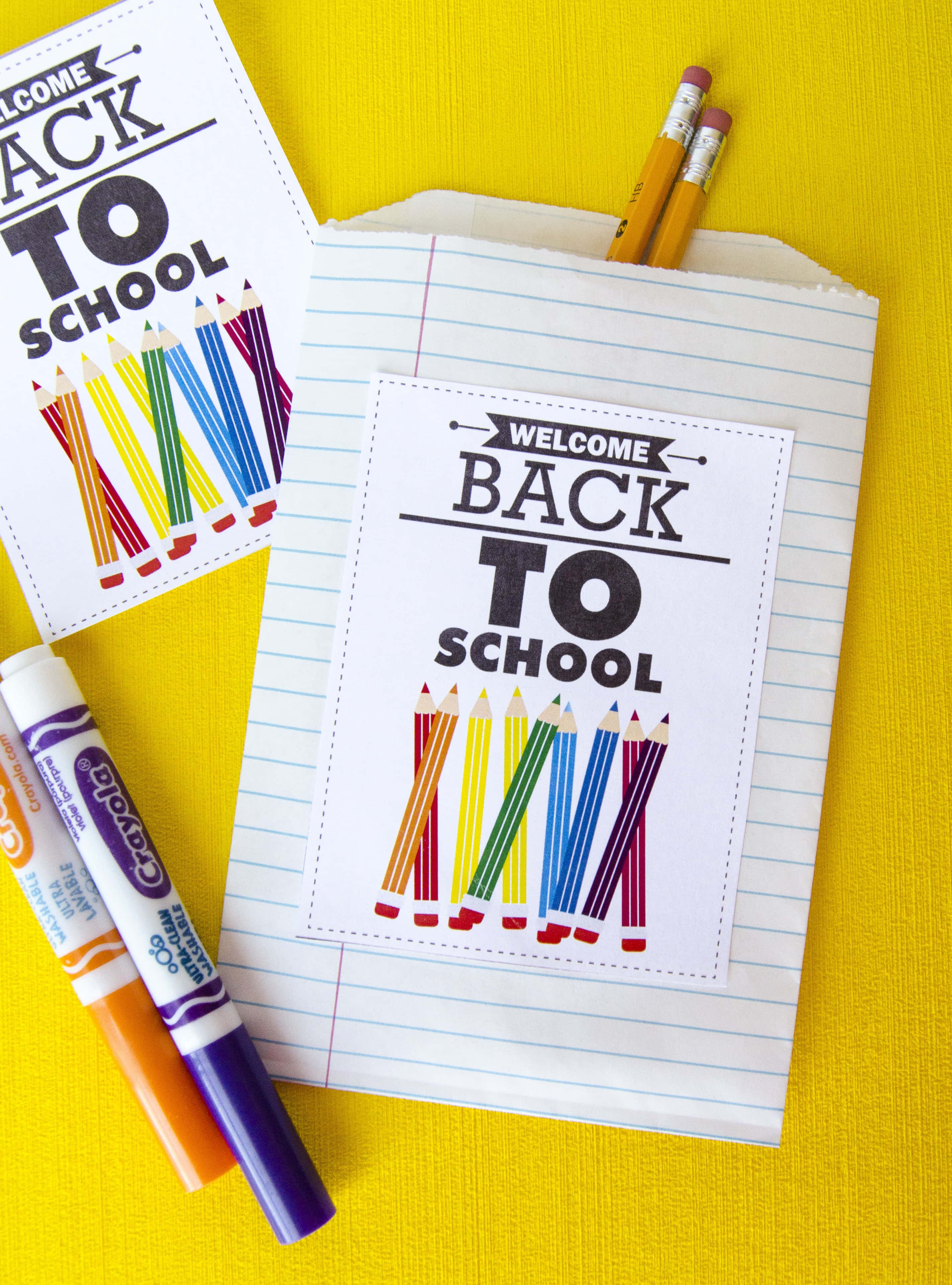 Vibrant yellow, lined paper bags, colorful pencils, 2K Phone Wallpaper