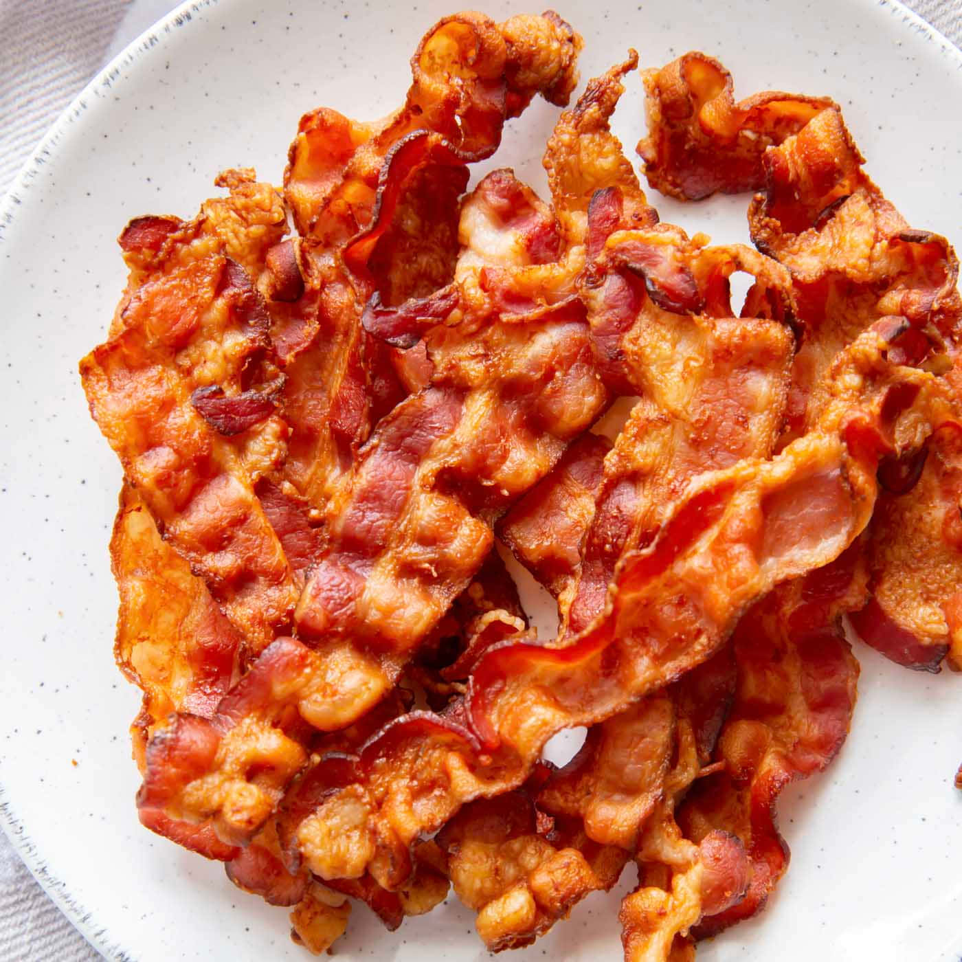 crispy bacon, golden-brown, speckled white plate, HD Desktop Wallpaper