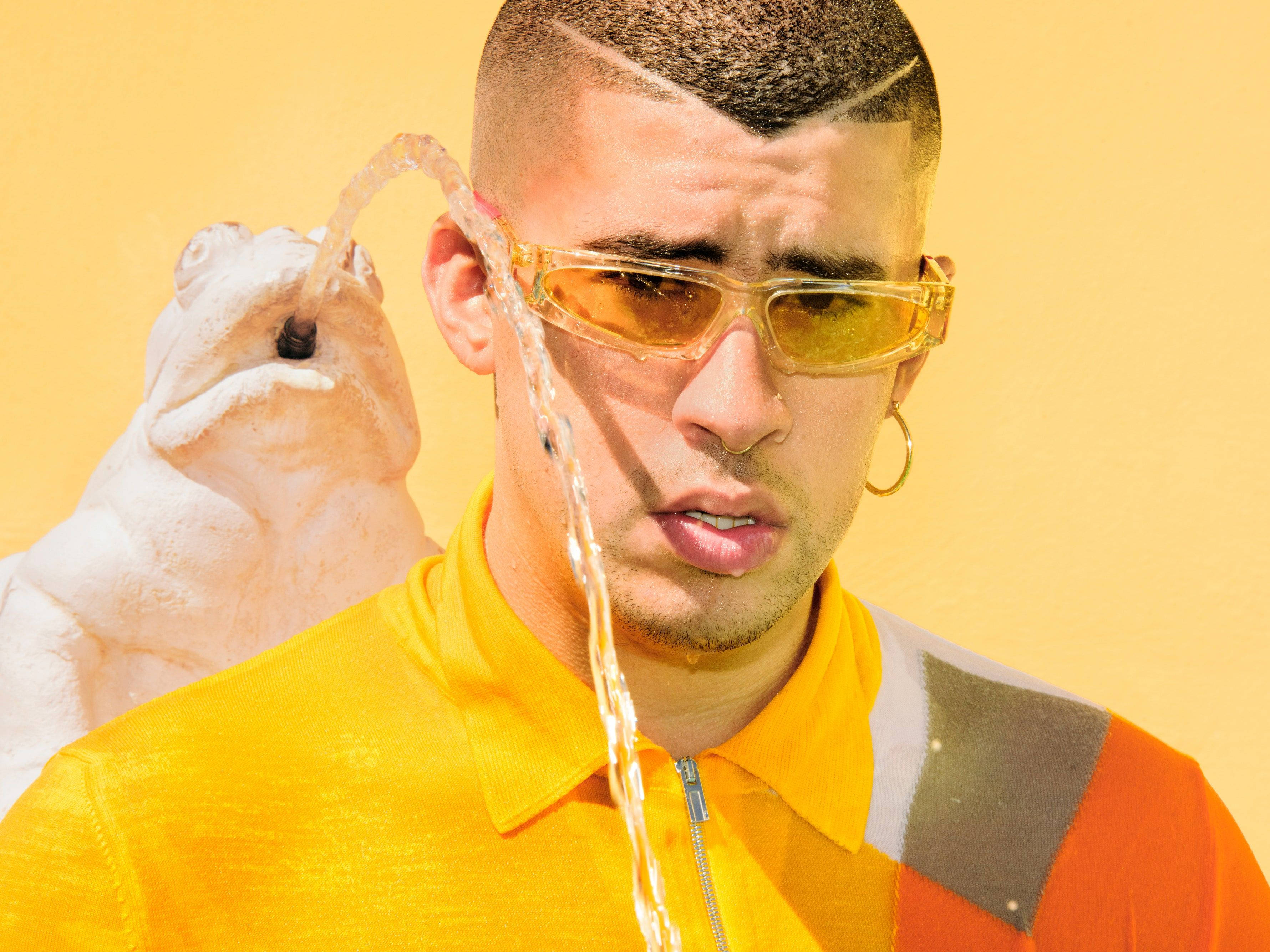 Bad Bunny, white frog statue, yellow sunglasses, 2K Desktop Wallpaper