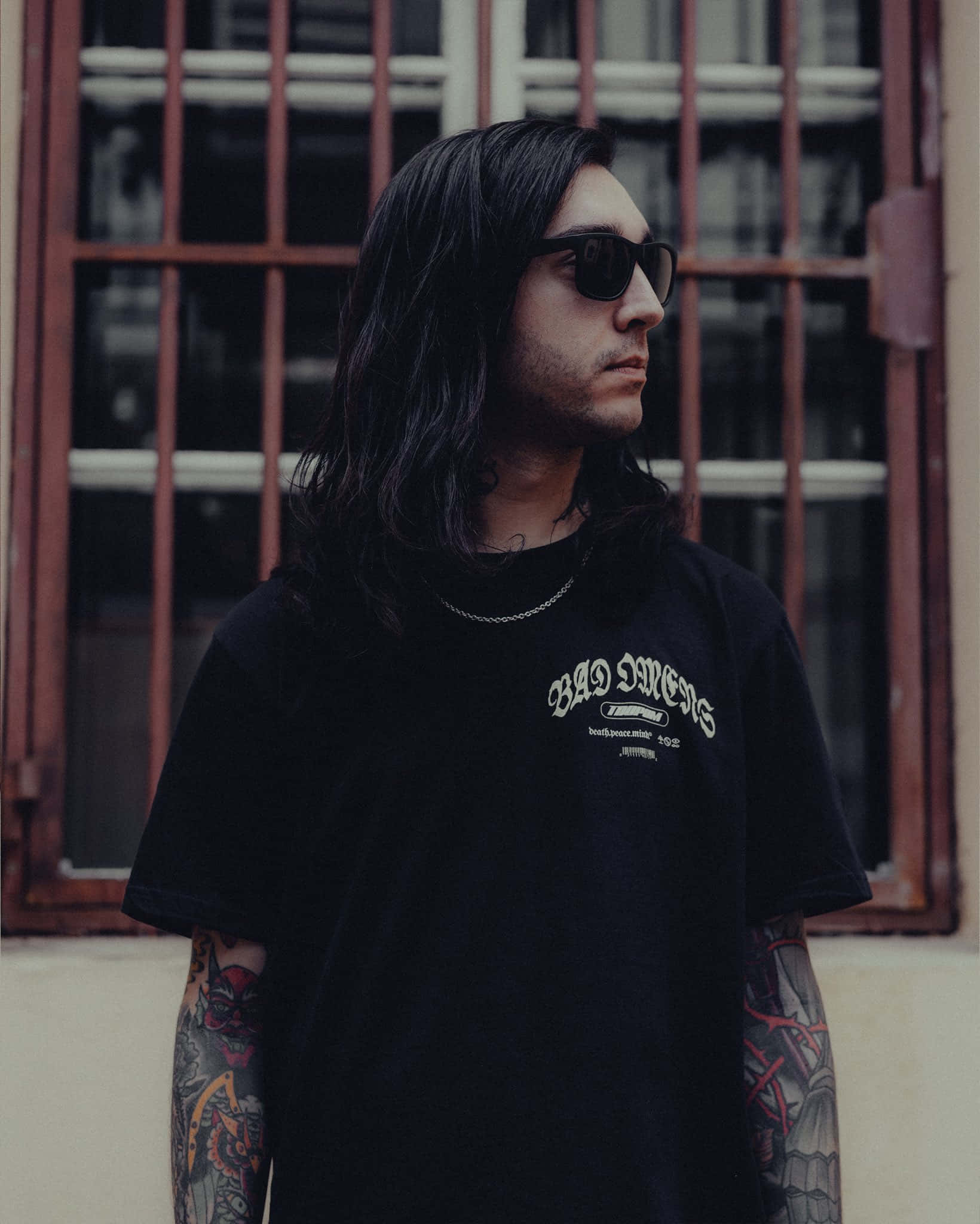 Bad Omens, black t-shirt, red windowed building, Full HD Phone Wallpaper
