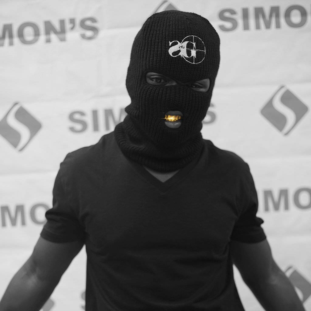 black balaclava, gold mouthpiece, branded backdrop, SD Desktop Wallpaper