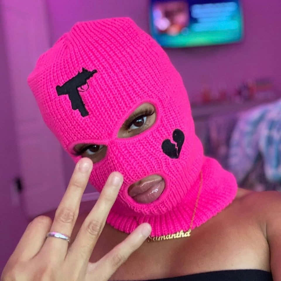 pink baddie ski mask, bright pink knitted balaclava, black gun patch, SD Desktop Wallpaper