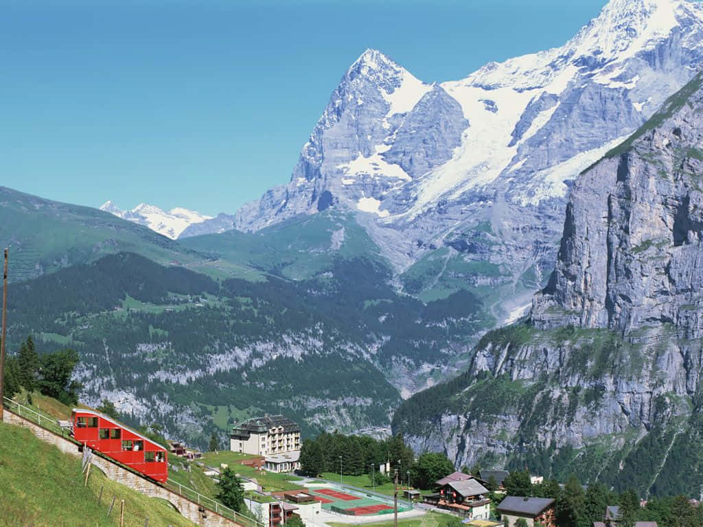 Baden, Switzerland, vibrant red train, grassy slope, SD Desktop Wallpaper