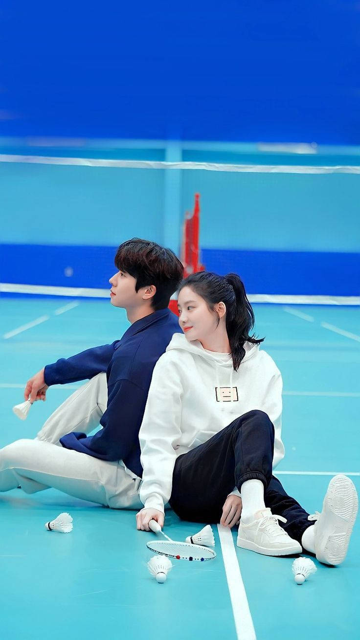 Korean couple, vibrant blue badminton court, rackets, HD Phone Wallpaper