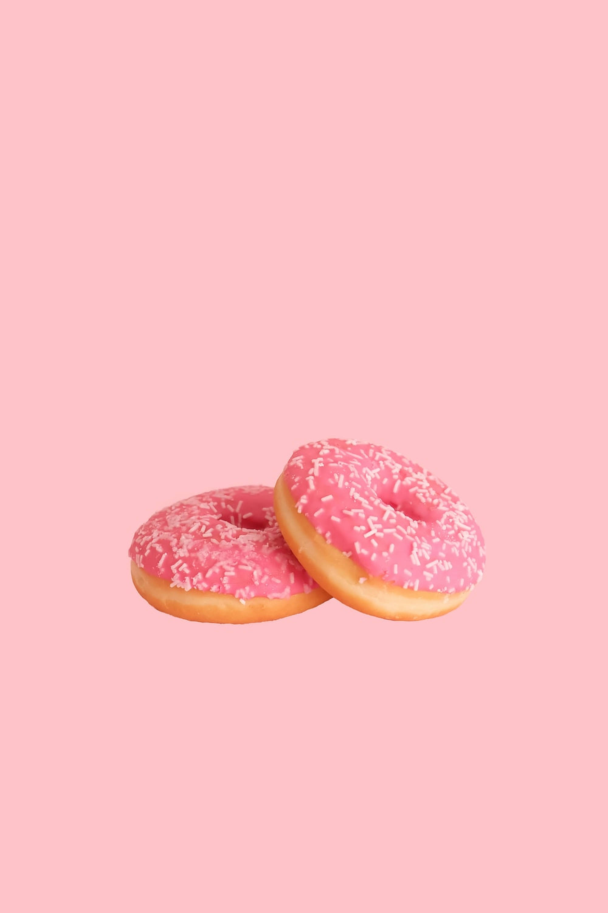 pink doughnut bakery, pink-frosted donuts, white sprinkles, 2K Phone Wallpaper