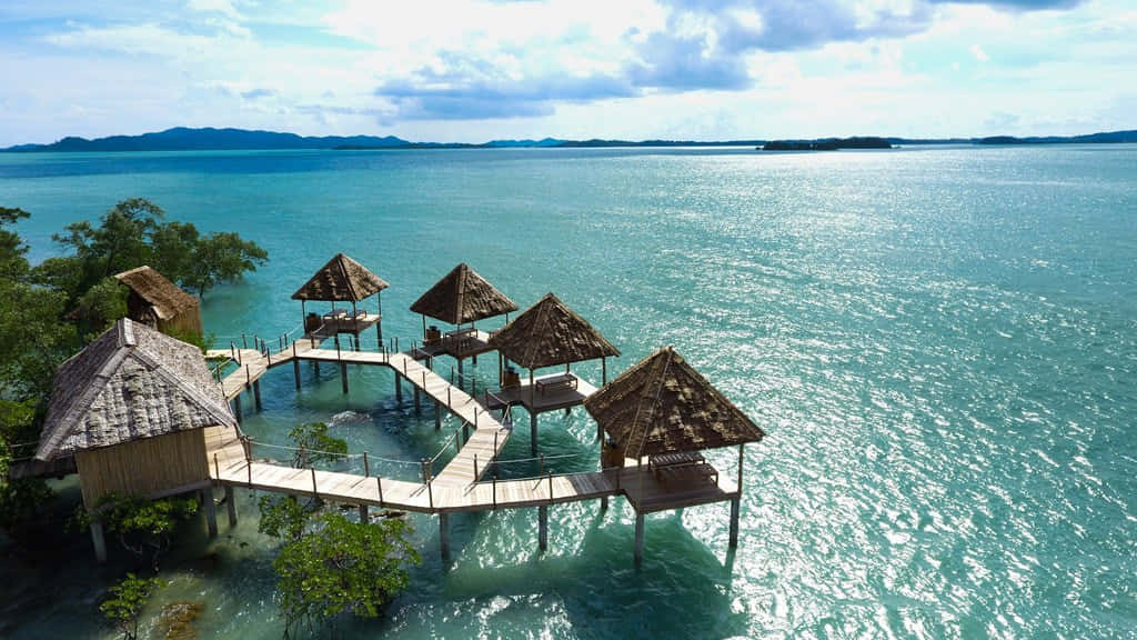 Bali Island, thatched-roof overwater bungalows, wooden walkways, SD Desktop Wallpaper