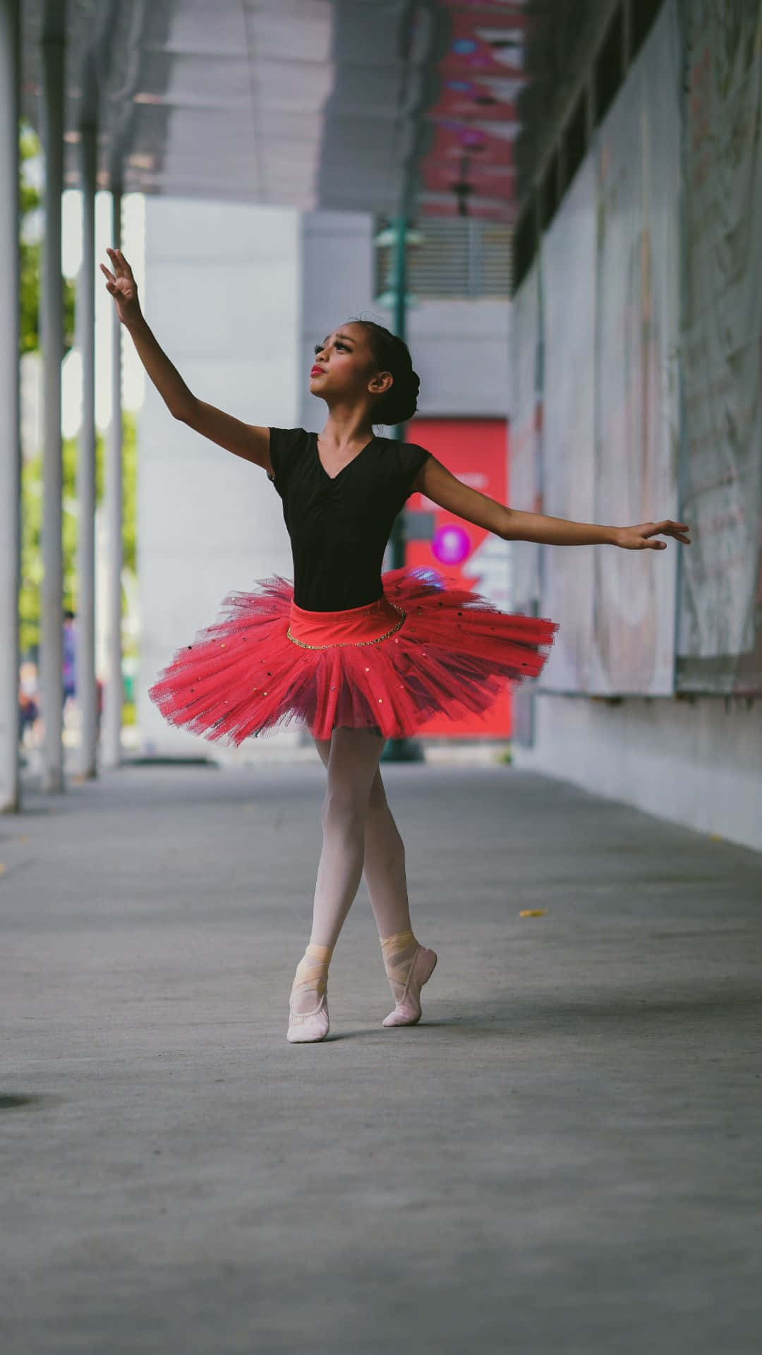 Ballerina, red tutu, gracefully poses en pointe, Full HD Phone Wallpaper