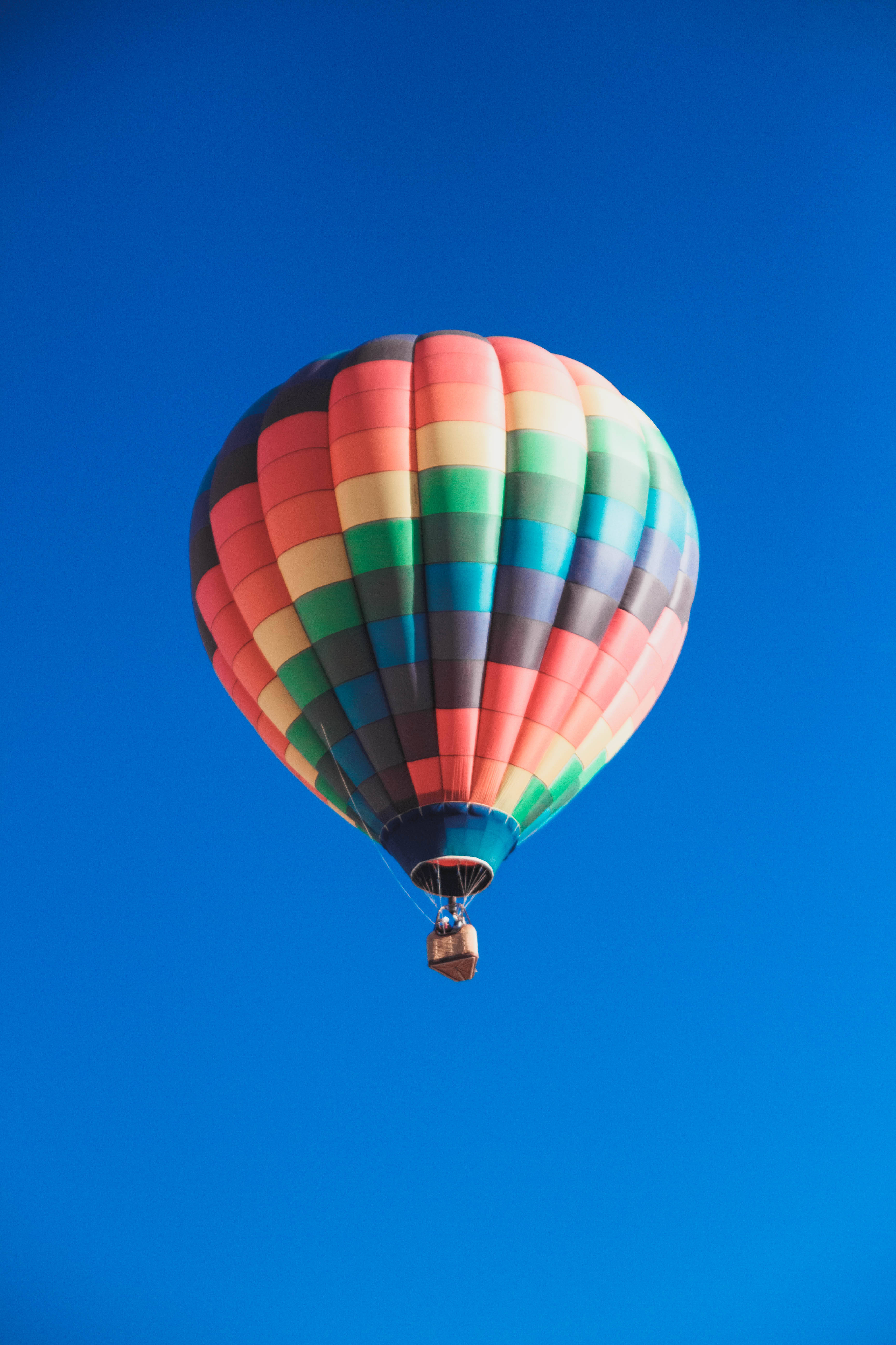 vector hot air balloon, multicolored, deep blue sky, 5K Phone Wallpaper