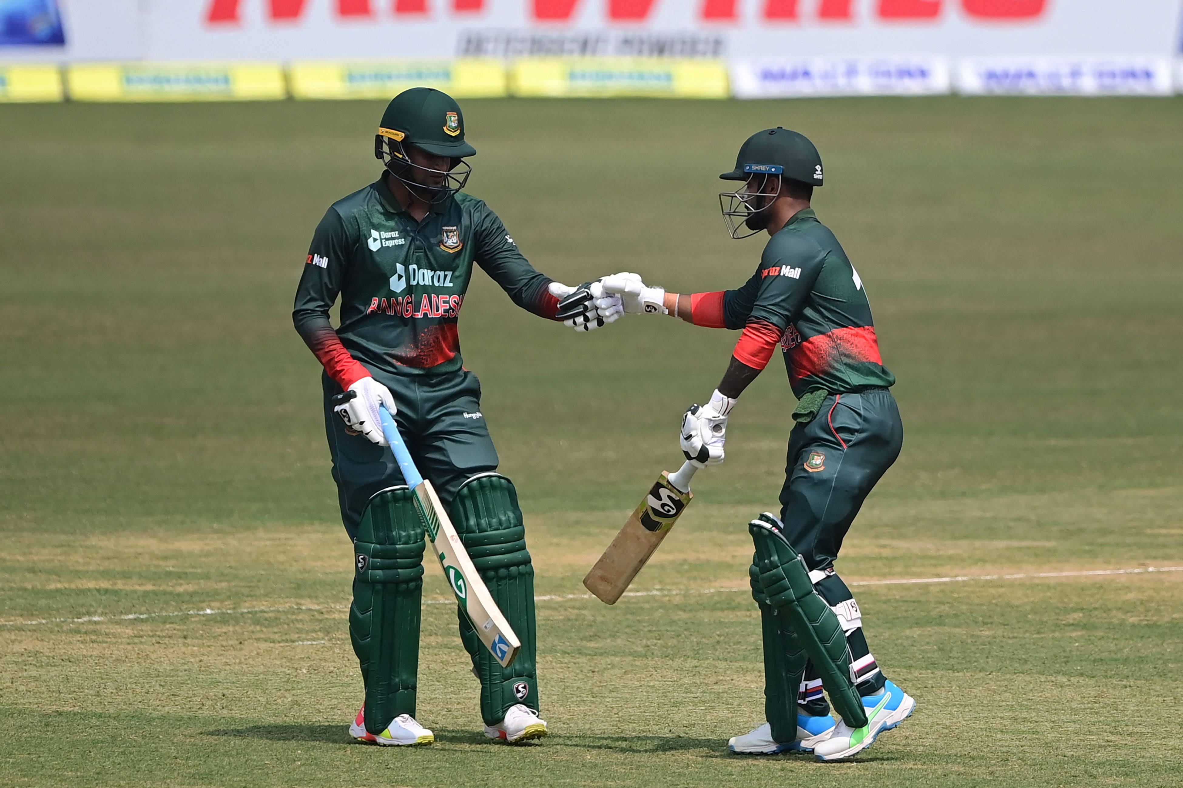 Bangladesh Cricket Team, green uniforms, sunlit grass field, 4K Desktop Wallpaper
