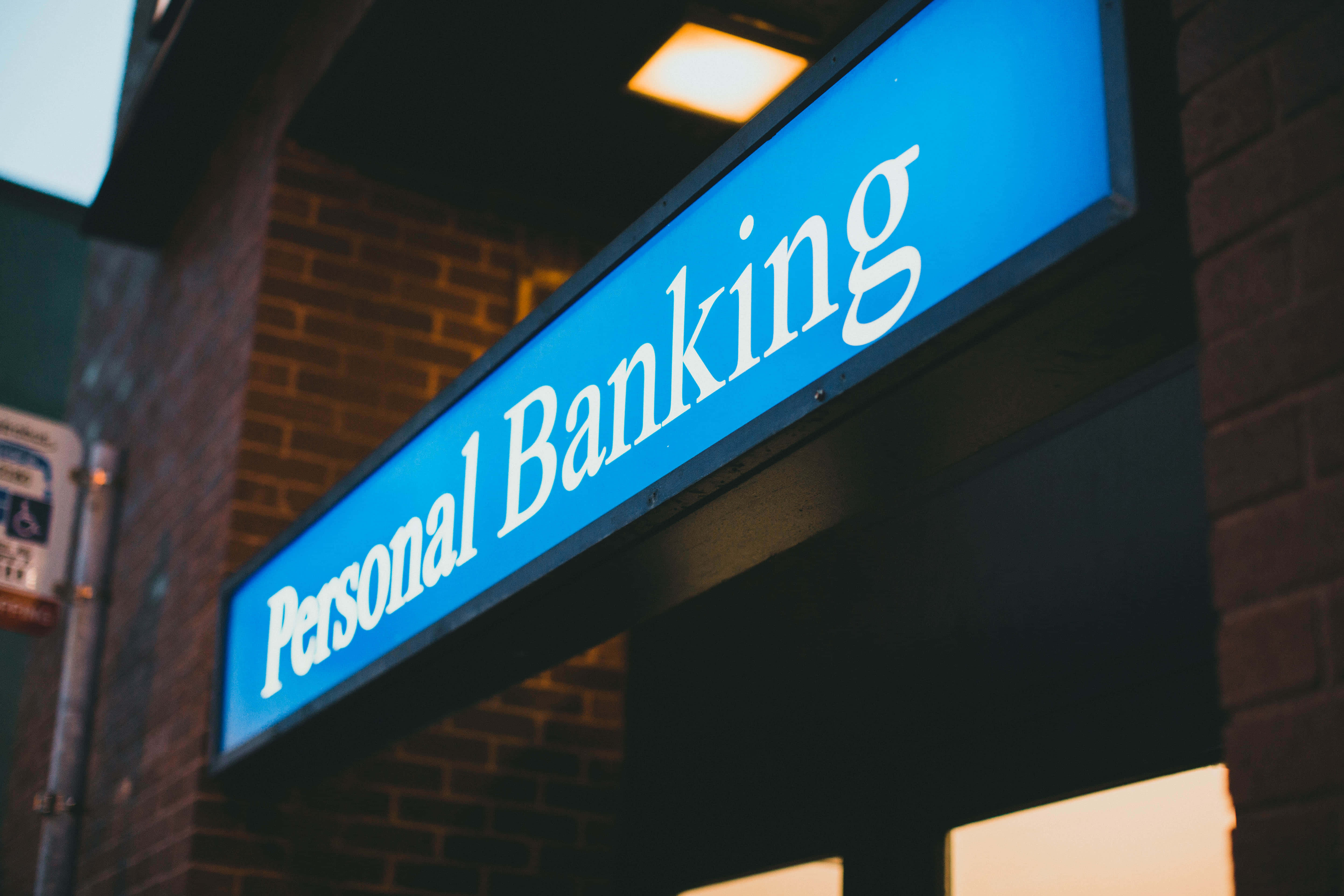 Personal Banking, glowing blue, brick building, 5K Desktop Wallpaper