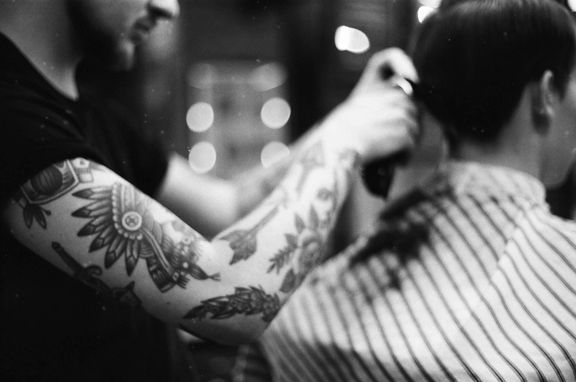 tattooed barber, dimly lit barbershop, bokeh lights, Full HD Desktop Wallpaper