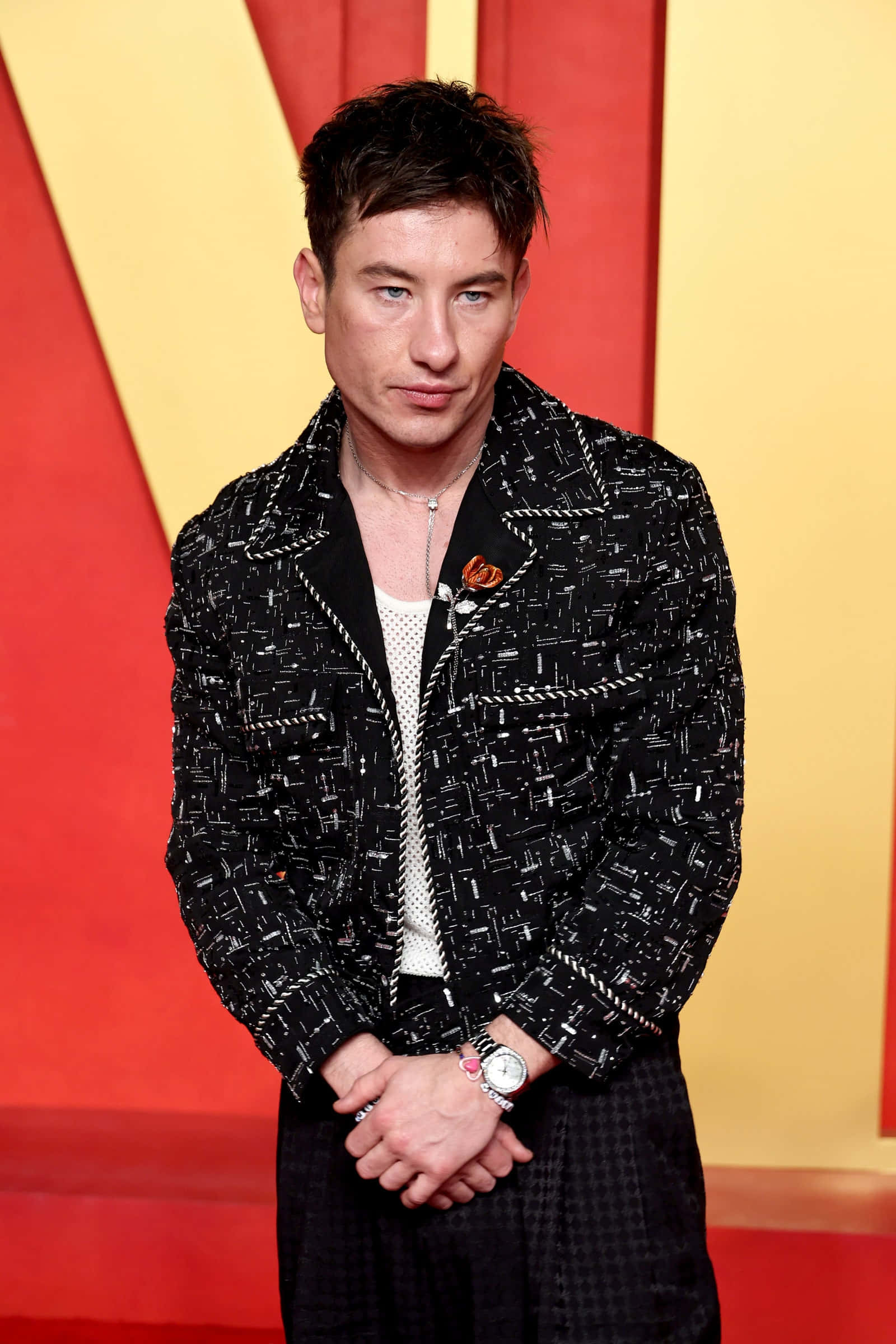 Barry Keoghan, black patterned jacket, bold red and yellow backdrop, Full HD Phone Wallpaper