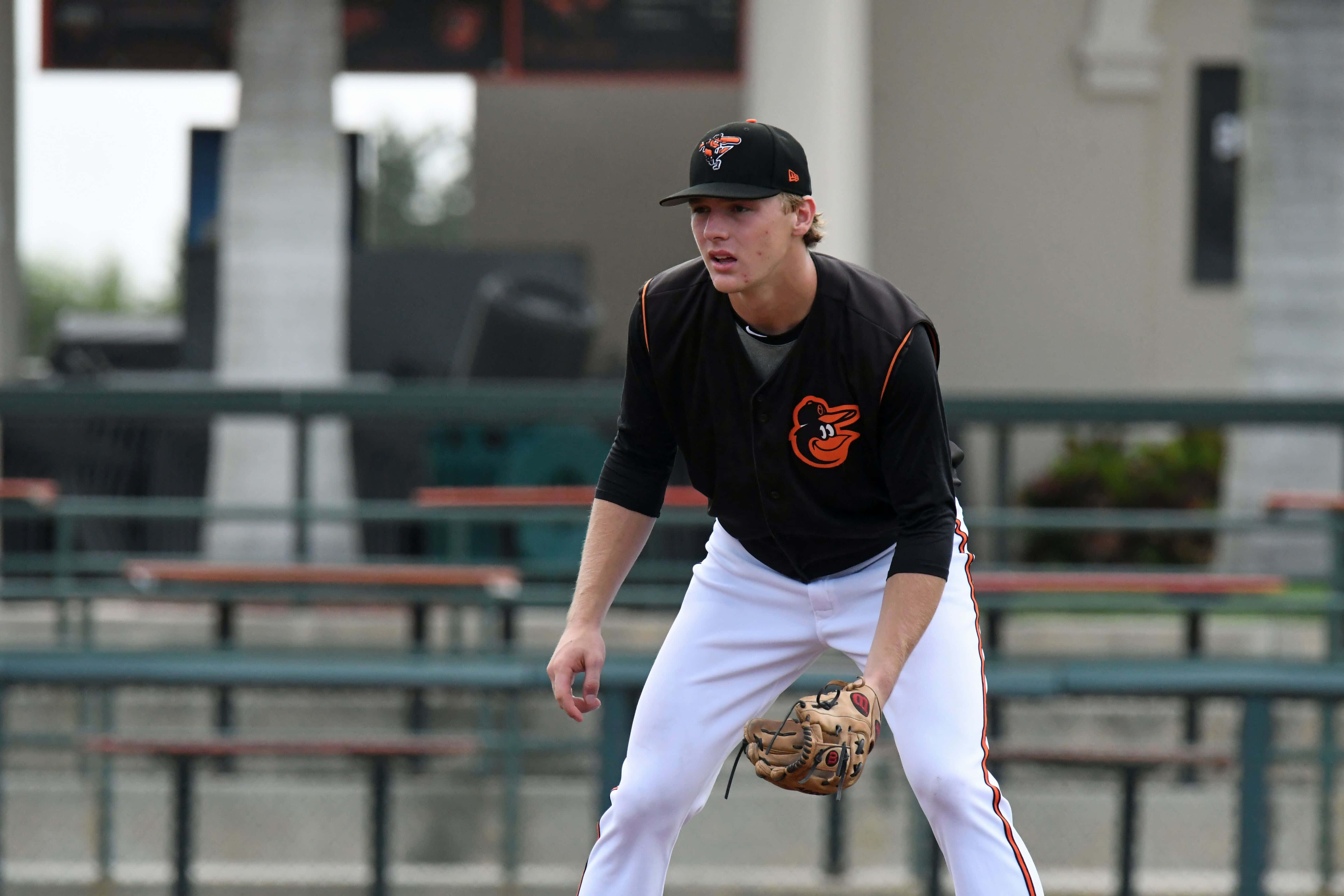 baseball player, black and orange uniform, crouches ready to field a ball, 5K Desktop Wallpaper