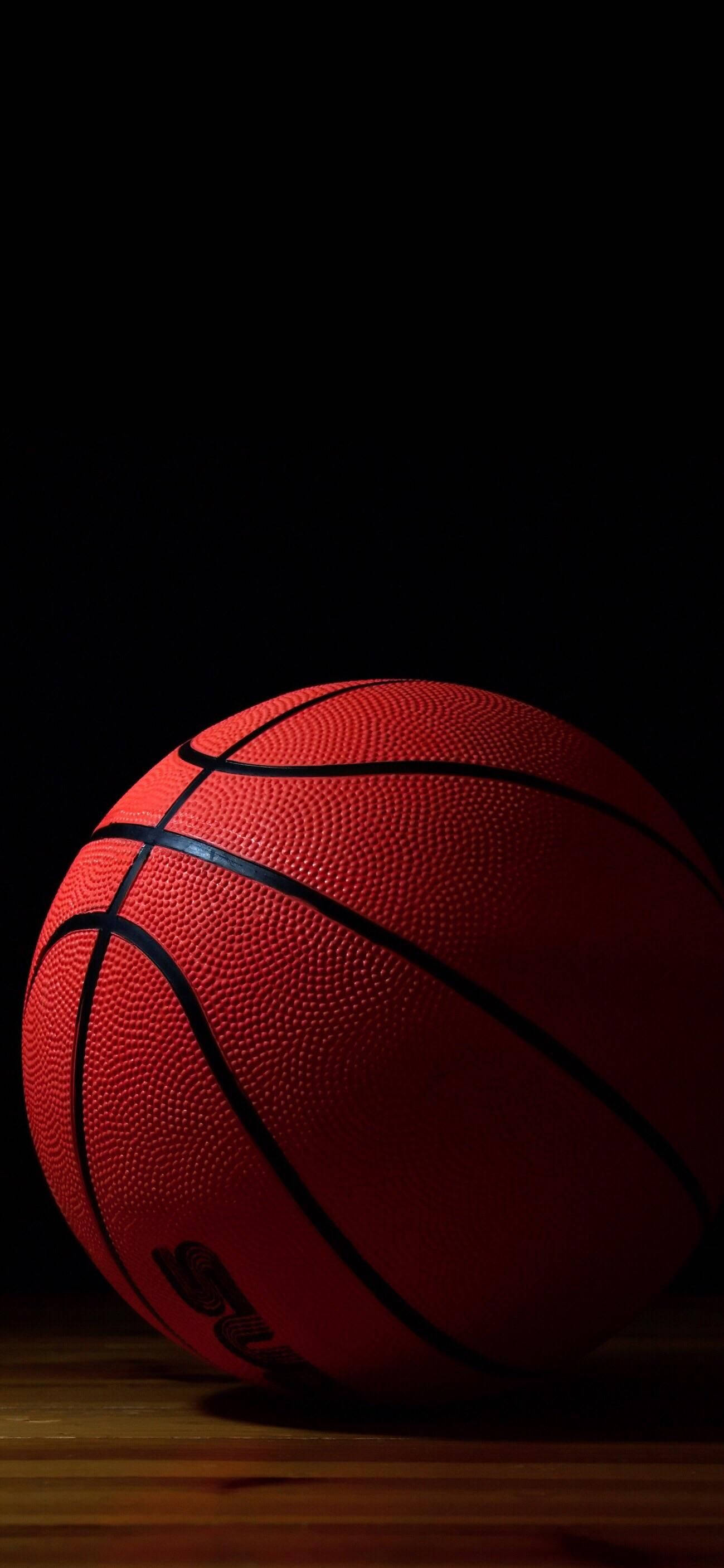 Basketball, wooden floor, dramatic spotlight, 2K Phone Wallpaper