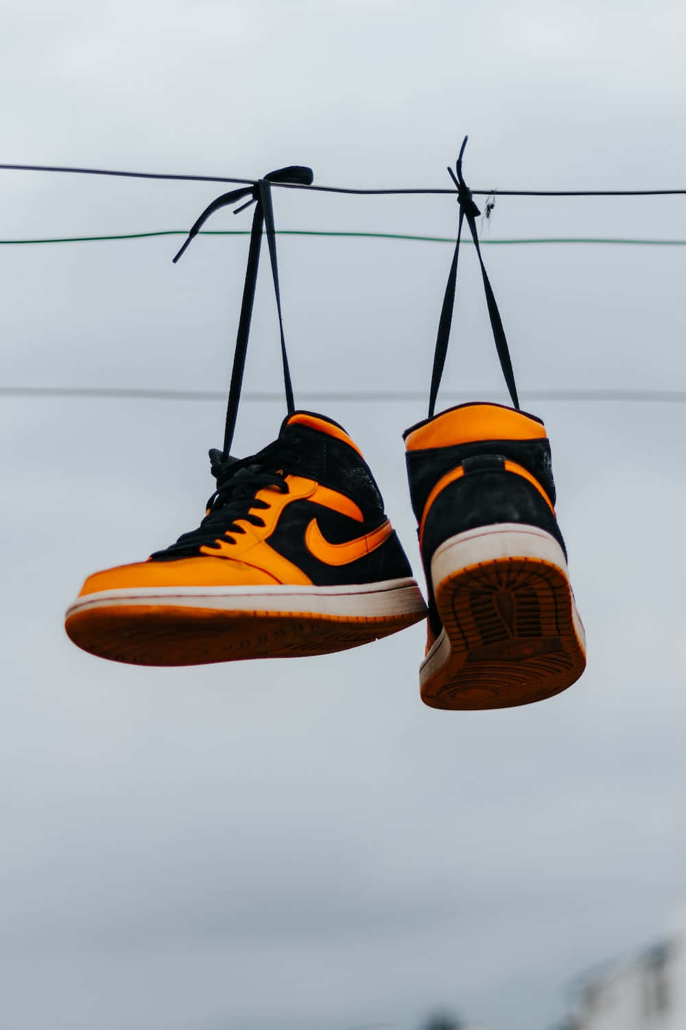 black and orange sneakers, hangs by laces, wire, HD Phone Wallpaper