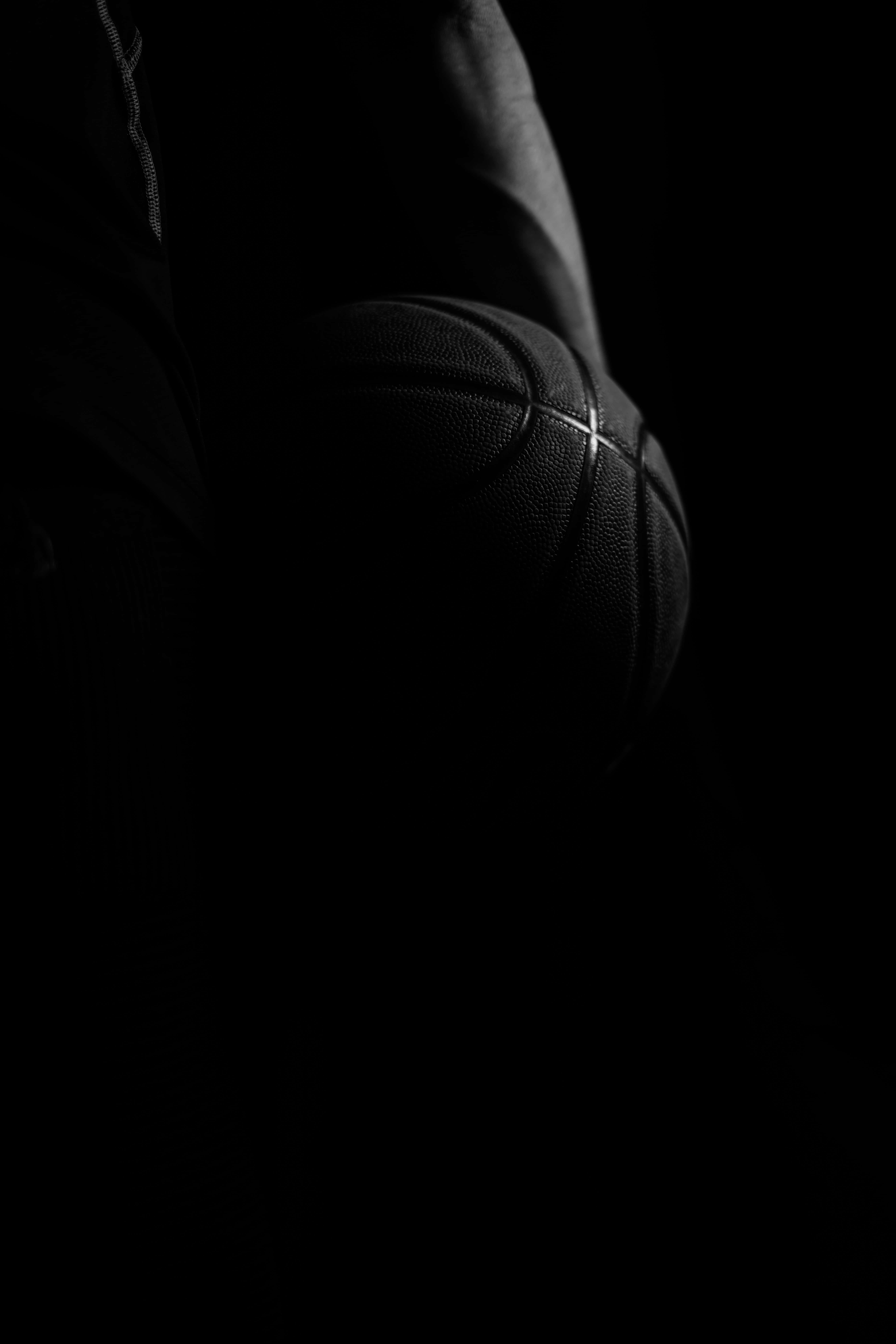 black basketball, silhouette, shadowed hands, 8K Phone Wallpaper