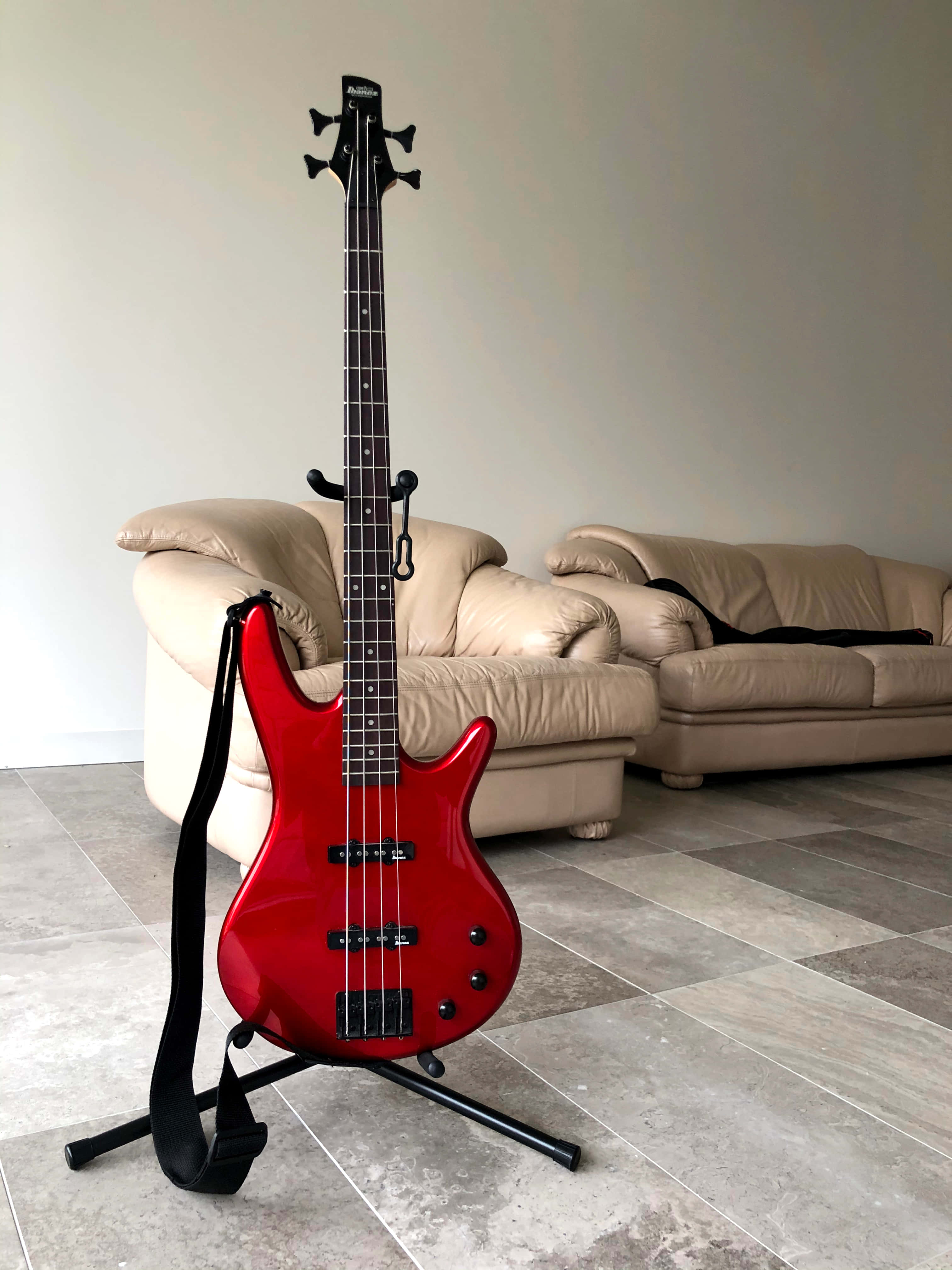 Red Bass Guitar Stand, glossy red electric bass guitar, minimalist living room, 4K Phone Wallpaper