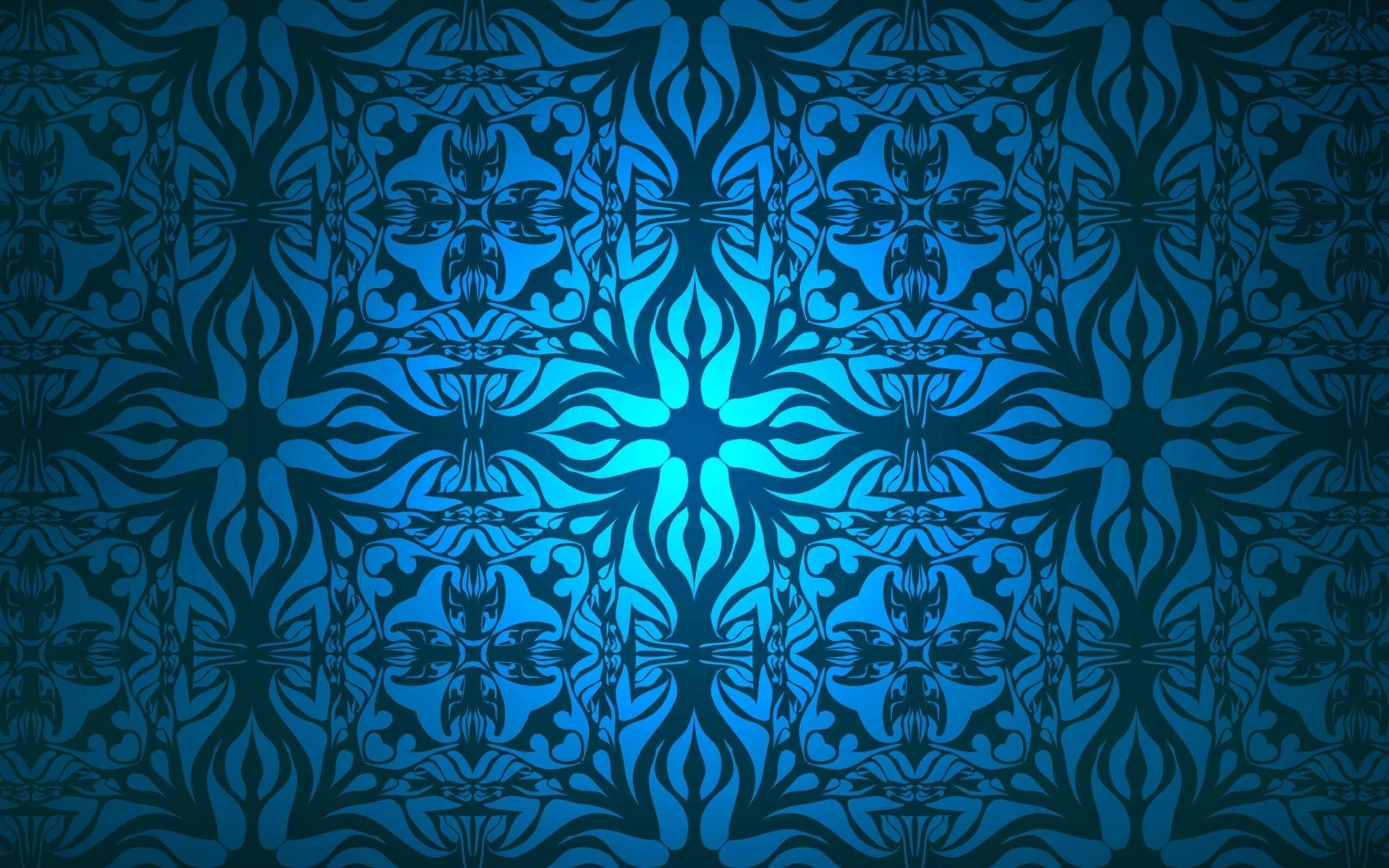 Batik Glow, blue patterned design, glowing central motif, 2K Desktop Wallpaper