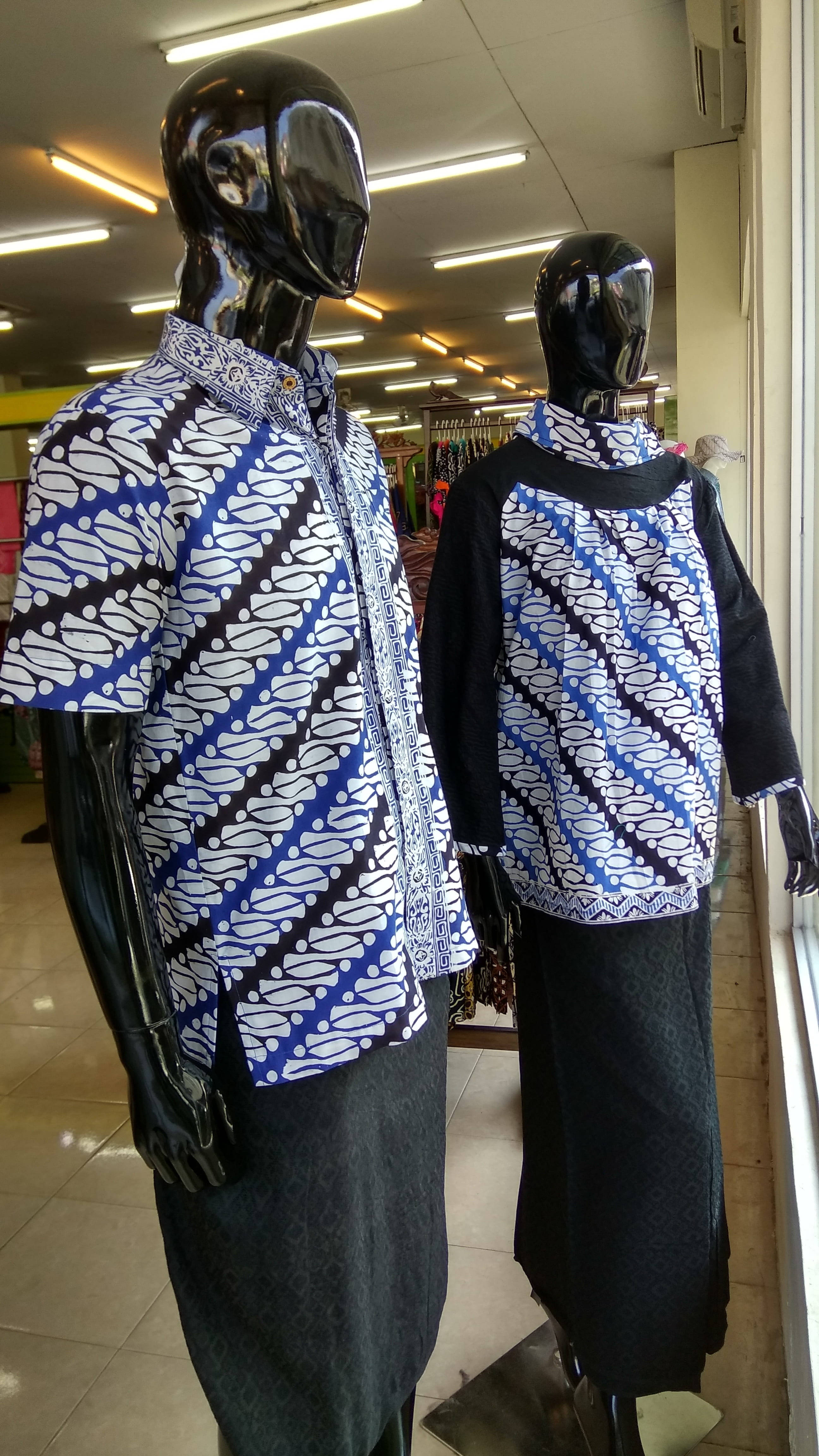 batik shirts, glossy black mannequins, vibrant blue white and black, 4K Phone Wallpaper