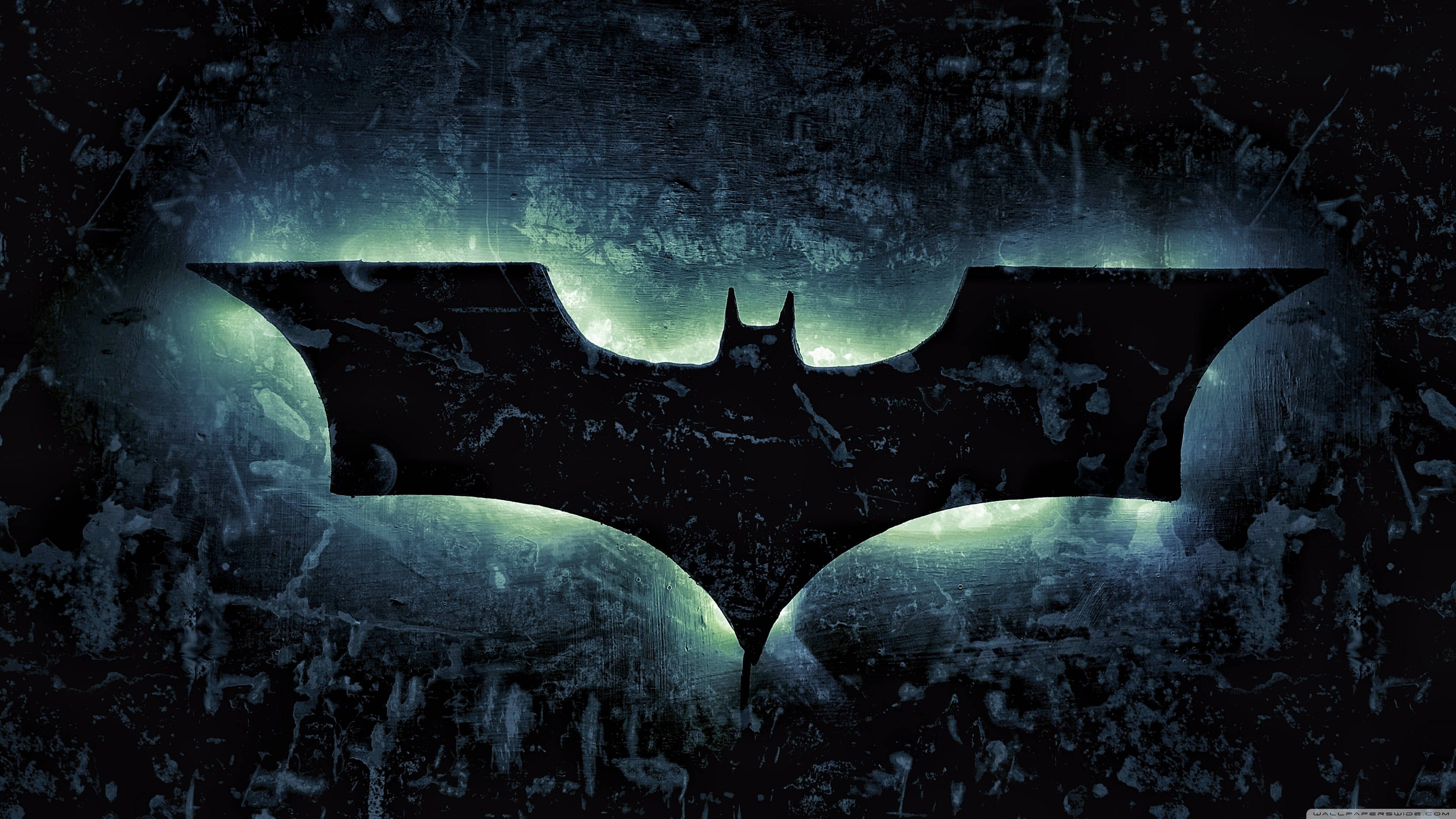 Batman, glowing green bat symbol, dark textured surface, 4K Desktop Wallpaper
