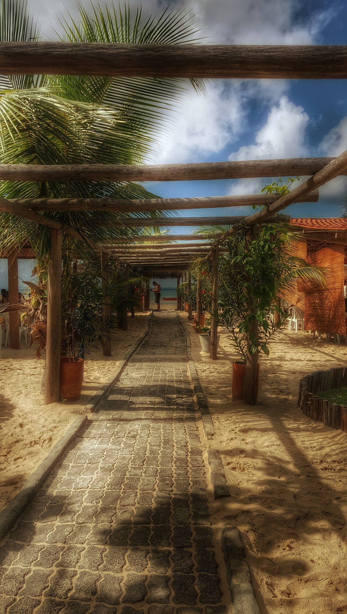 4K iPhone, cobblestone beach walkway, wooden pergola, Full HD Phone Wallpaper