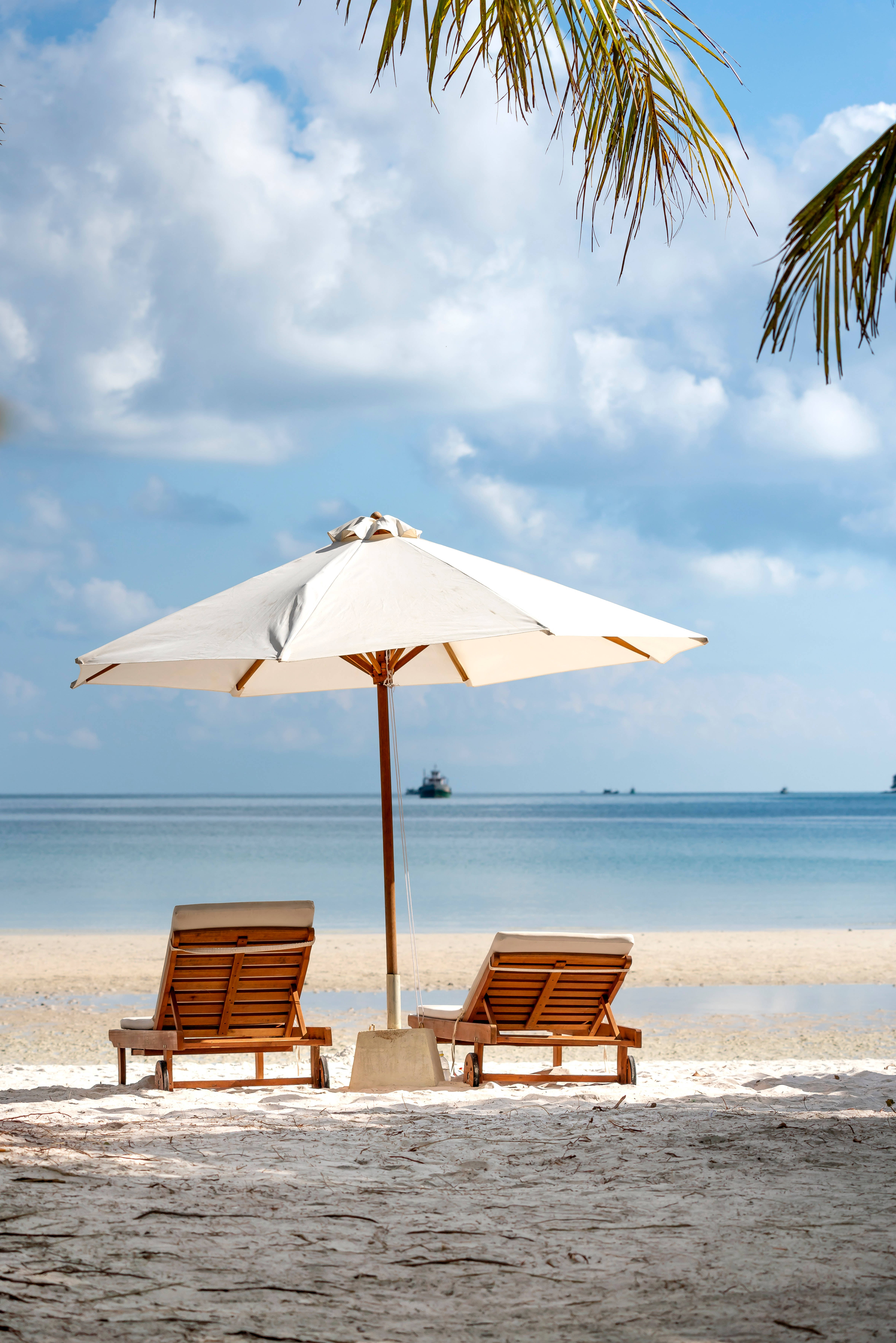 Beach Android, wooden lounge chairs, white umbrella, 5K Phone Wallpaper