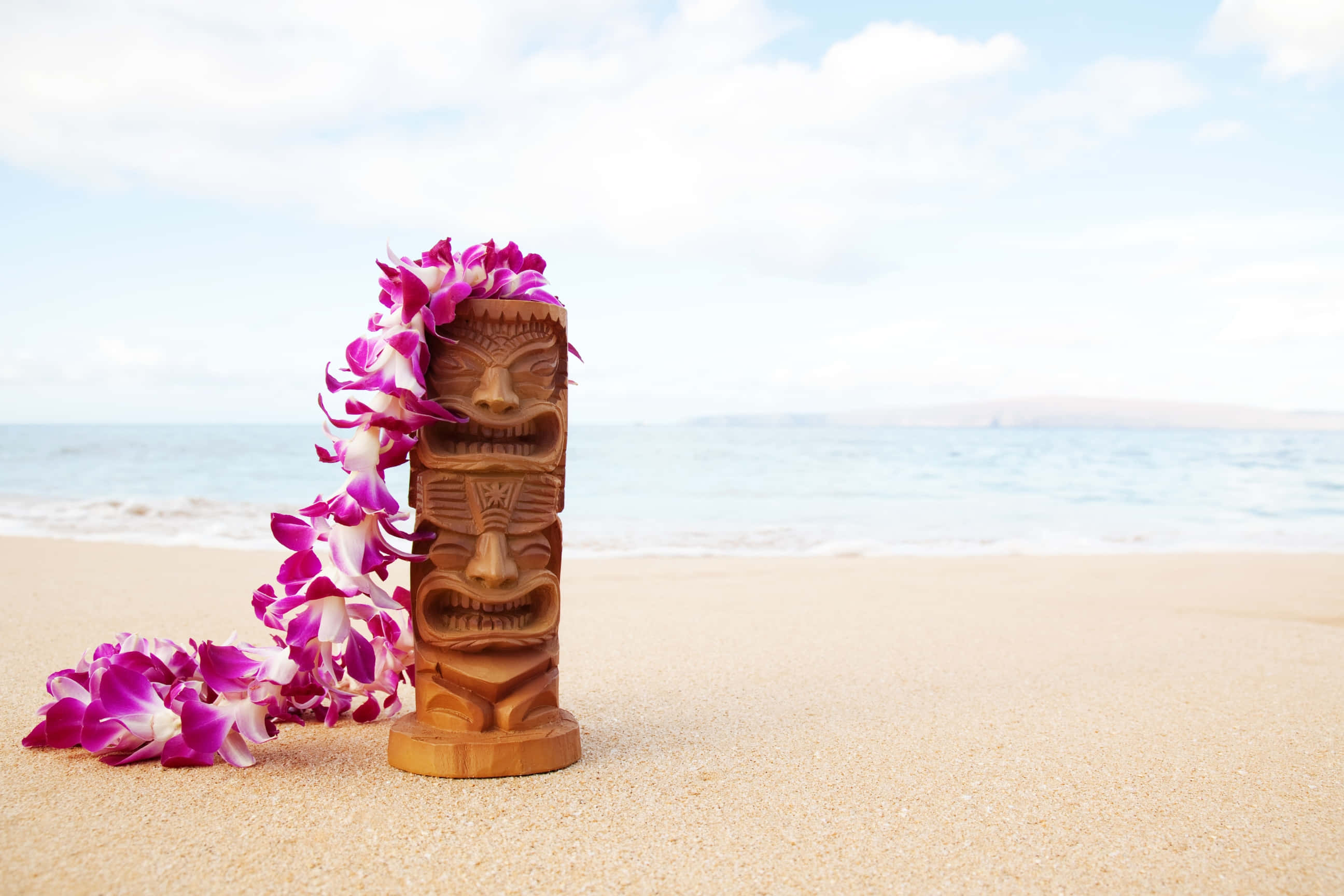 tiki statue, vibrant purple orchids, golden sand, 2K Desktop Wallpaper