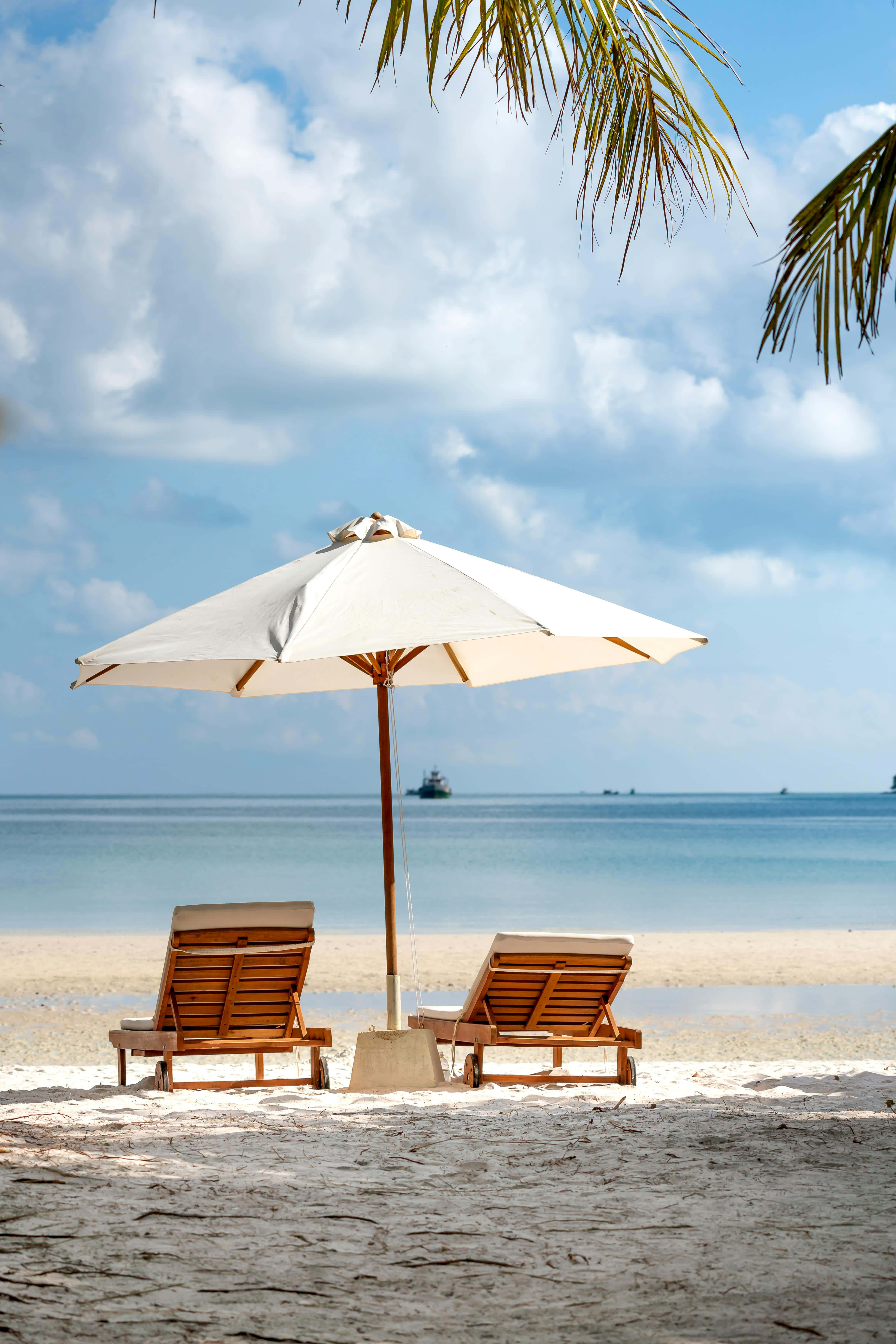 white umbrella, wooden lounge chairs, sandy beach, 5K Phone Wallpaper