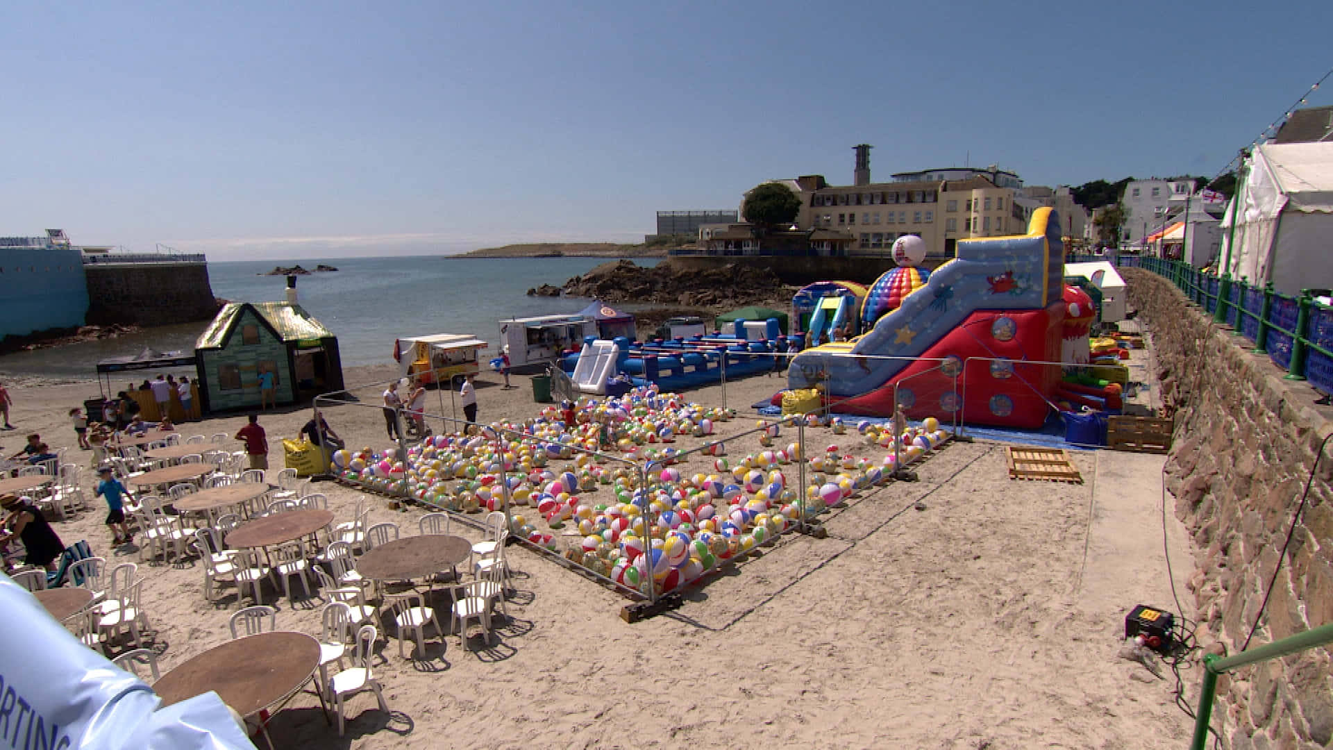 sunny beach scene, colorful inflatable slides, sea of balloons, Full HD Desktop Wallpaper
