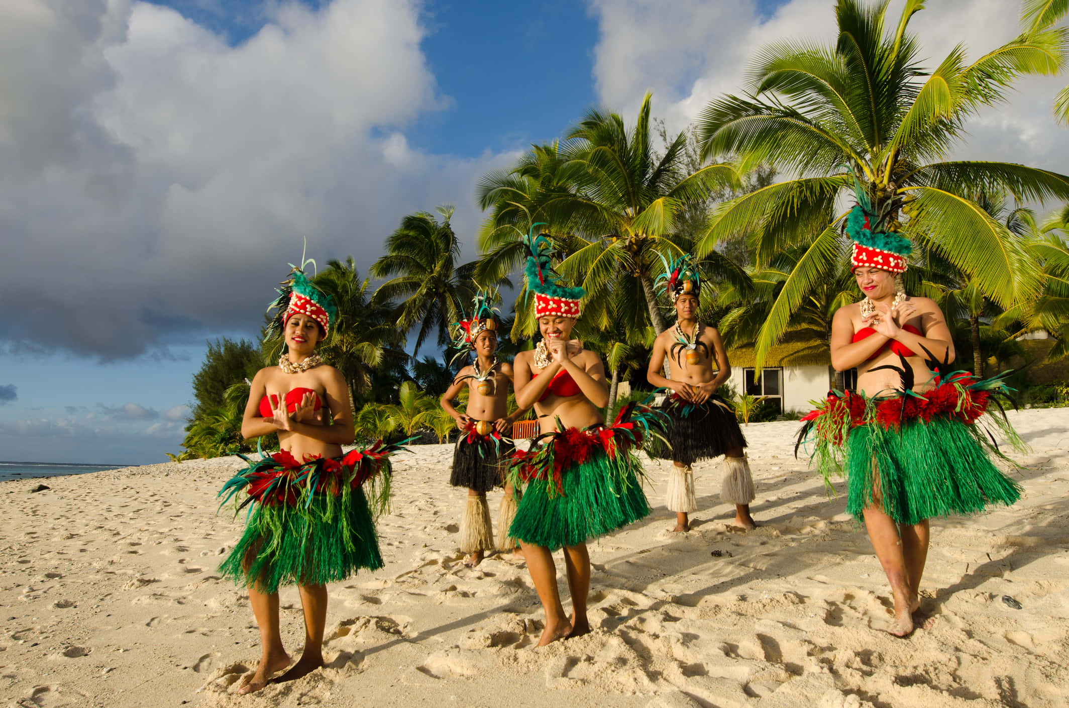 beach party, vibrant green grass skirts, feathered headdresses, Full HD Desktop Wallpaper
