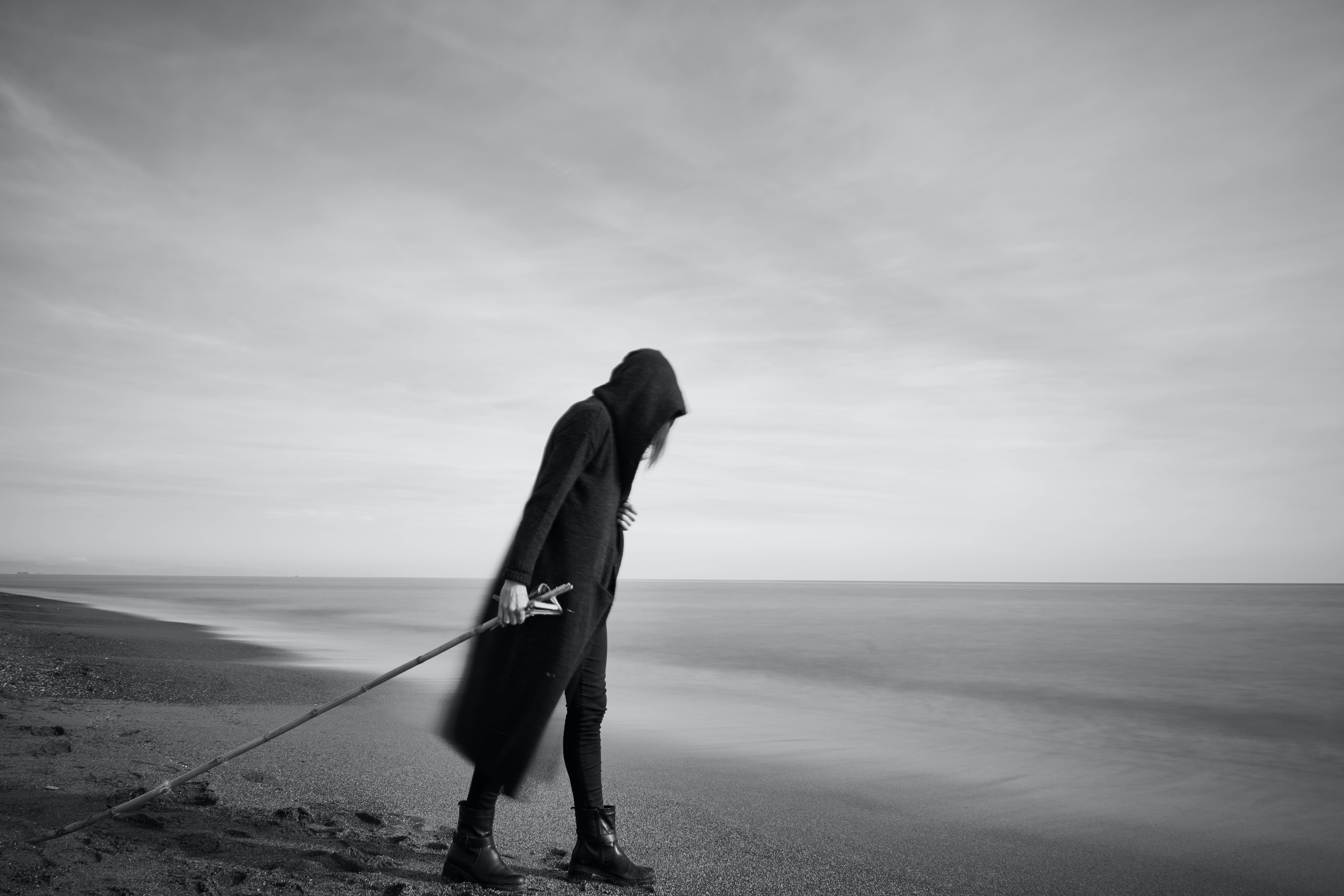 Pessimistic Beach Drag, hooded figure, misty beach, 8K Desktop Wallpaper