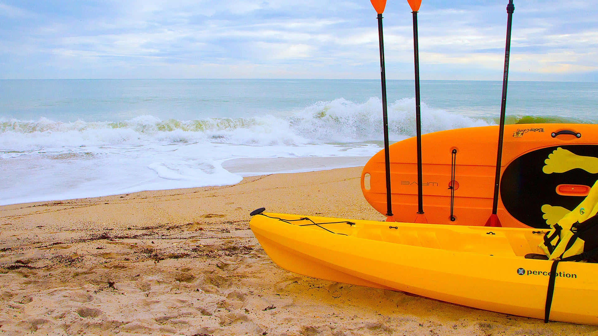 Vibrant yellow kayaks, sandy beach, ocean waves, Full HD Desktop Wallpaper