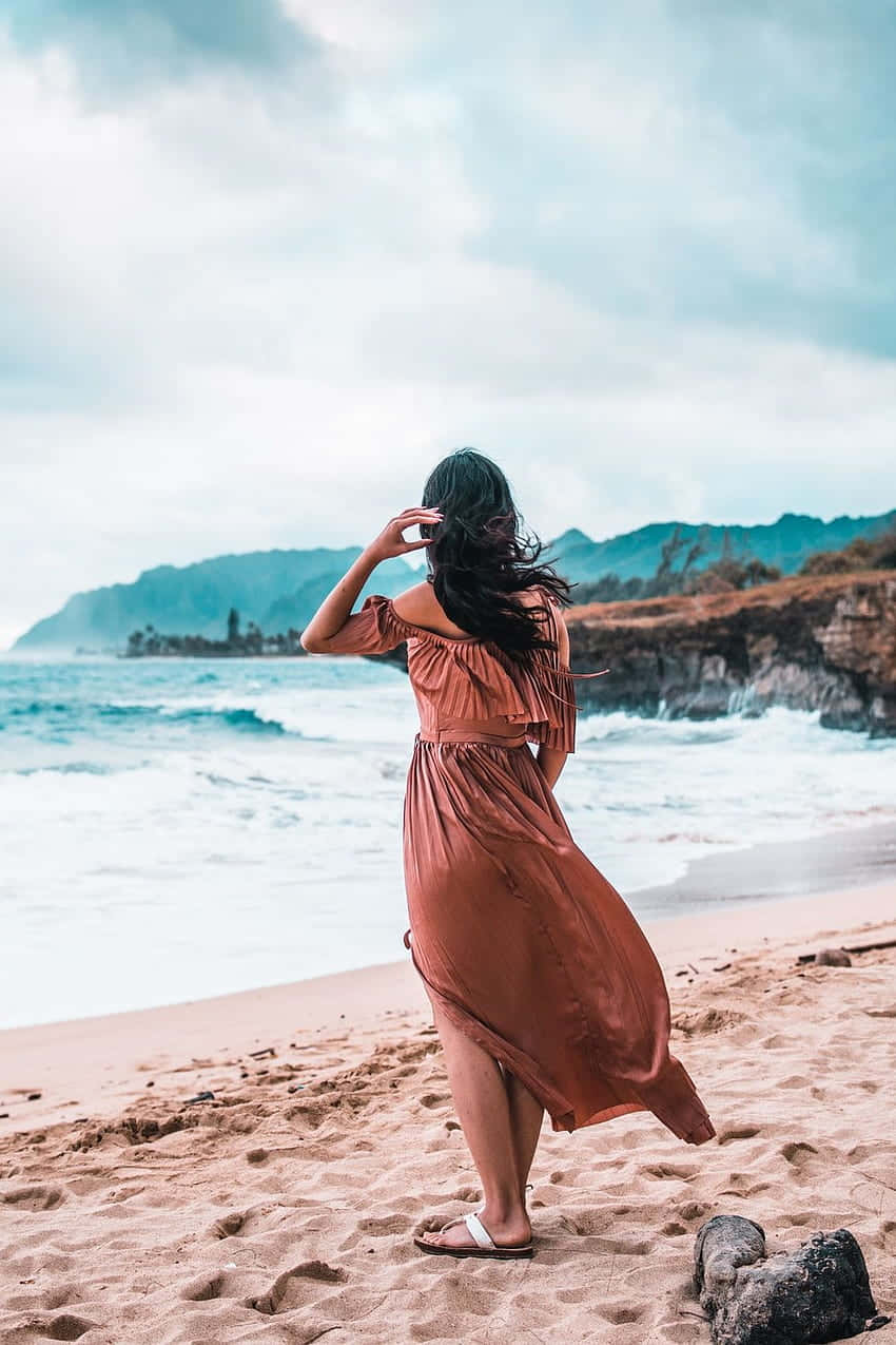 rust-colored dress, sandy beach, ocean, SD Phone Wallpaper