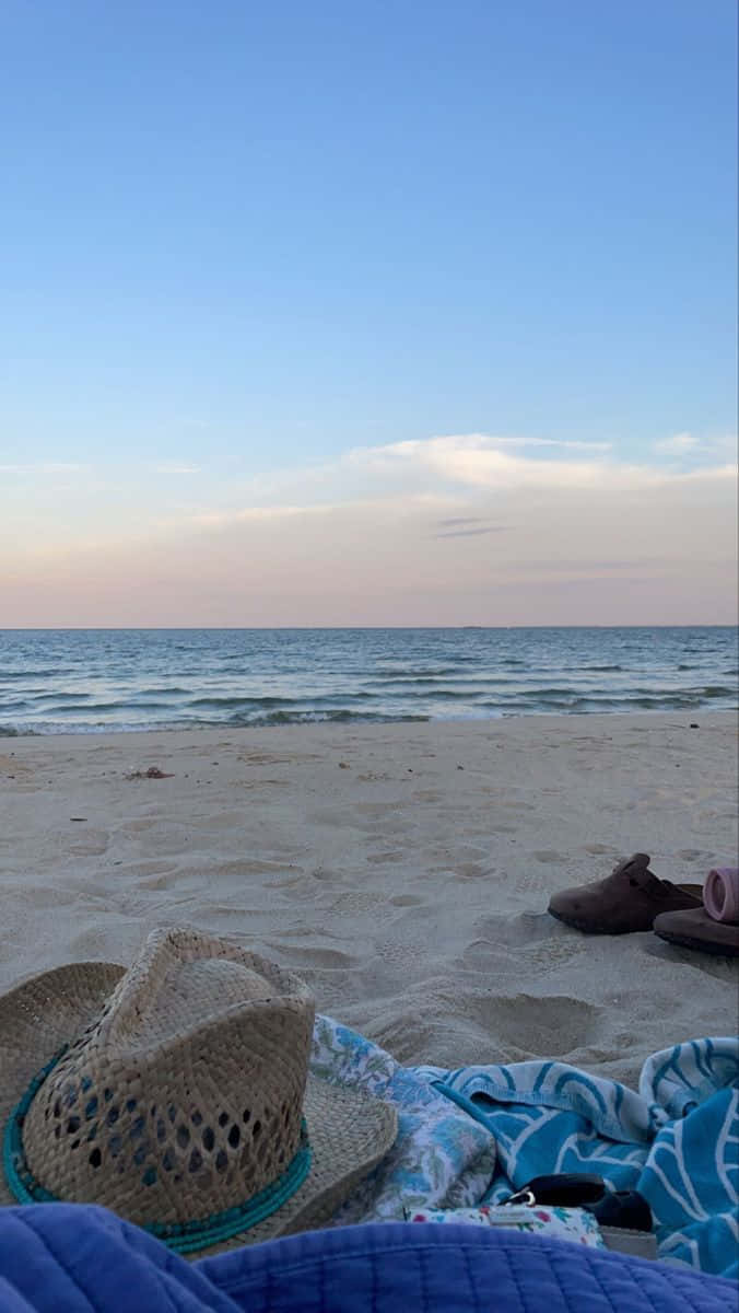 straw cowboy hat, blue towel, sandy beach, SD Phone Wallpaper