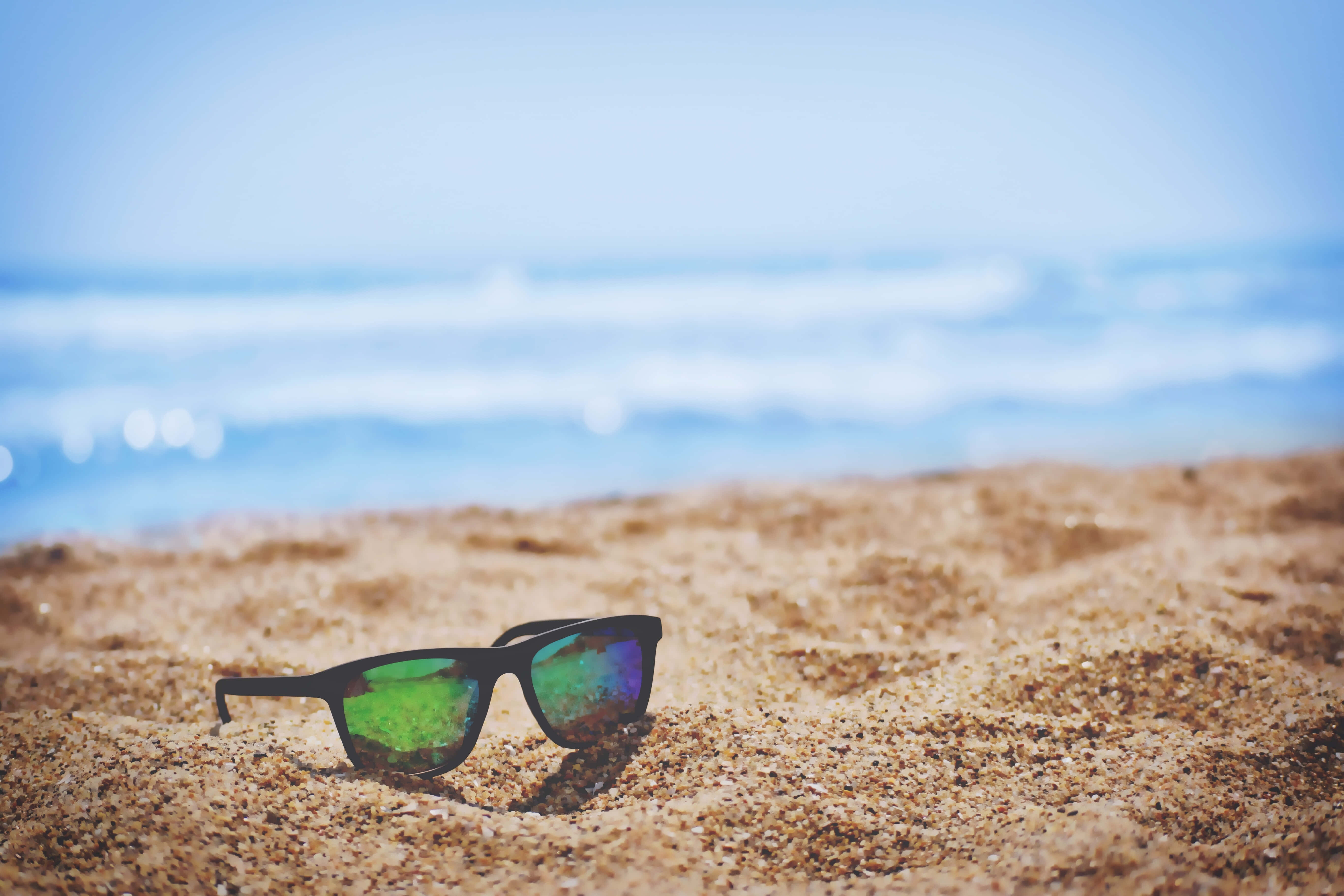 black sunglasses, green reflective lenses, golden sand, 5K Desktop Wallpaper