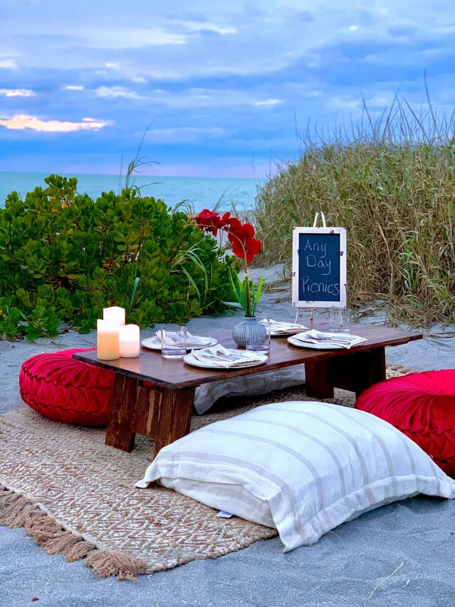 Beach Picnic, red cushions, candles, SD Phone Wallpaper