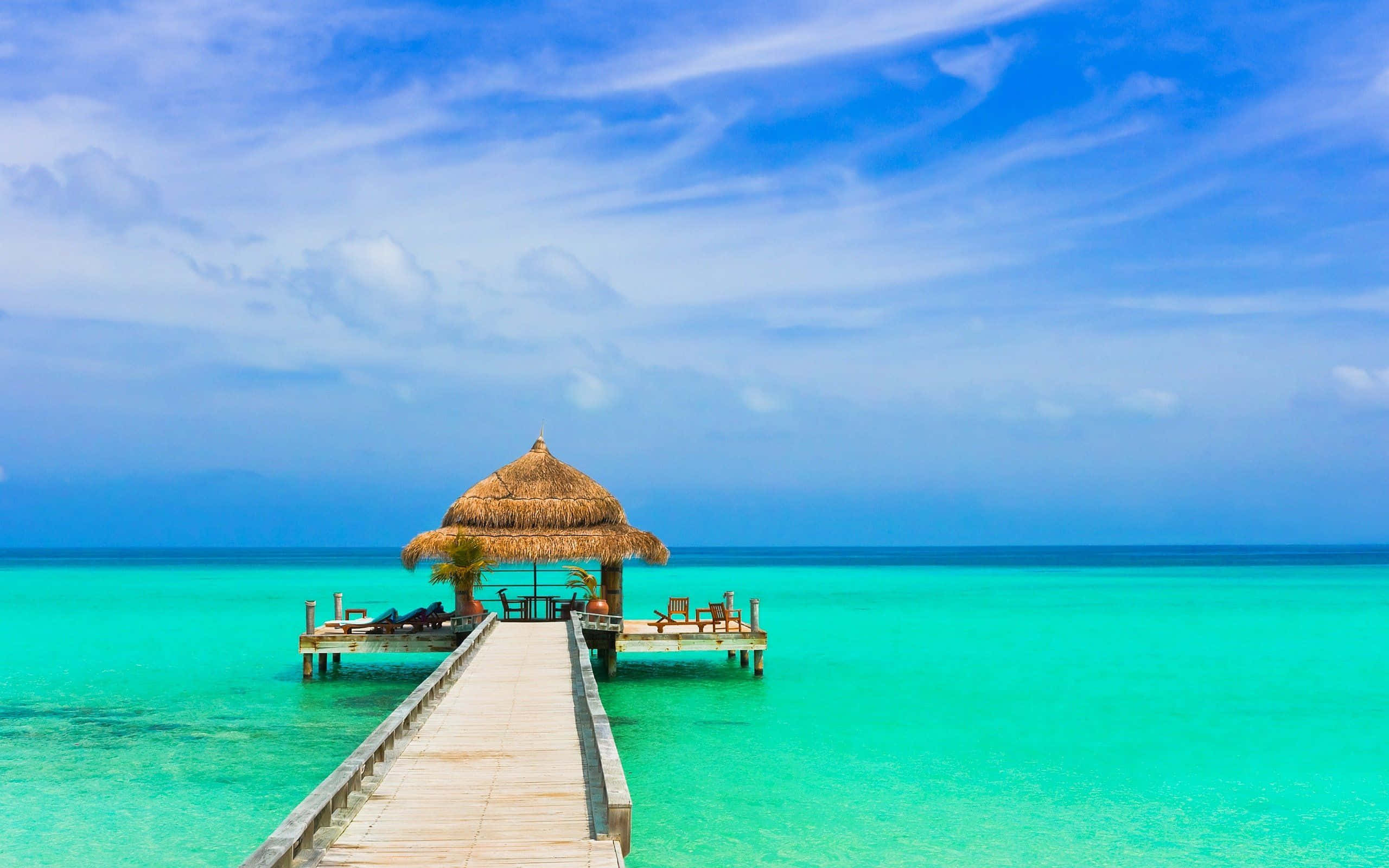 Beach Resort, wooden pier, vibrant turquoise water, 2K Desktop Wallpaper