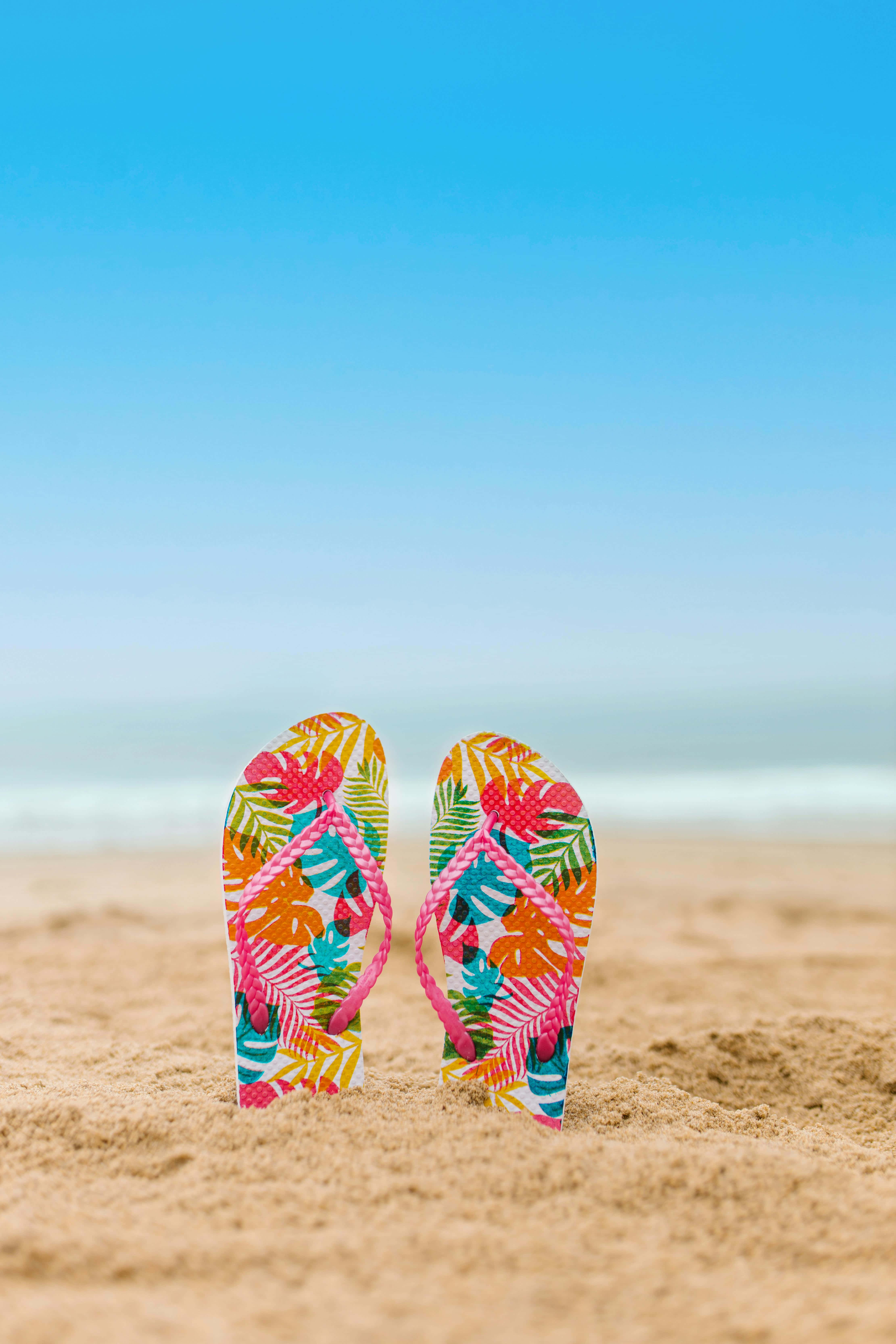 colorful beach flip flops, golden sand, clear blue sky, 5K Phone Wallpaper