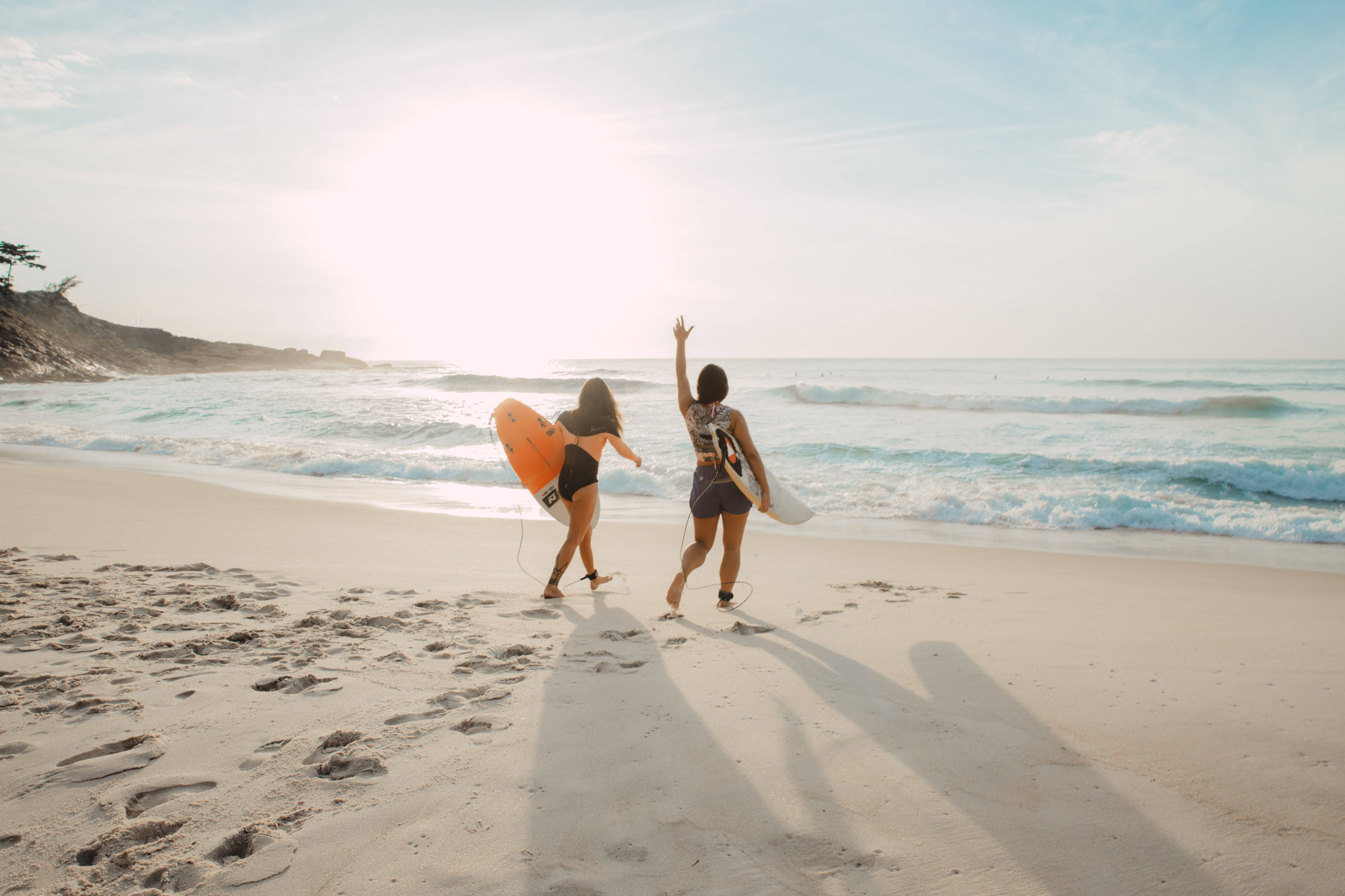 women holding surfboards, sunlit beach, surfboards, 5K Desktop Wallpaper