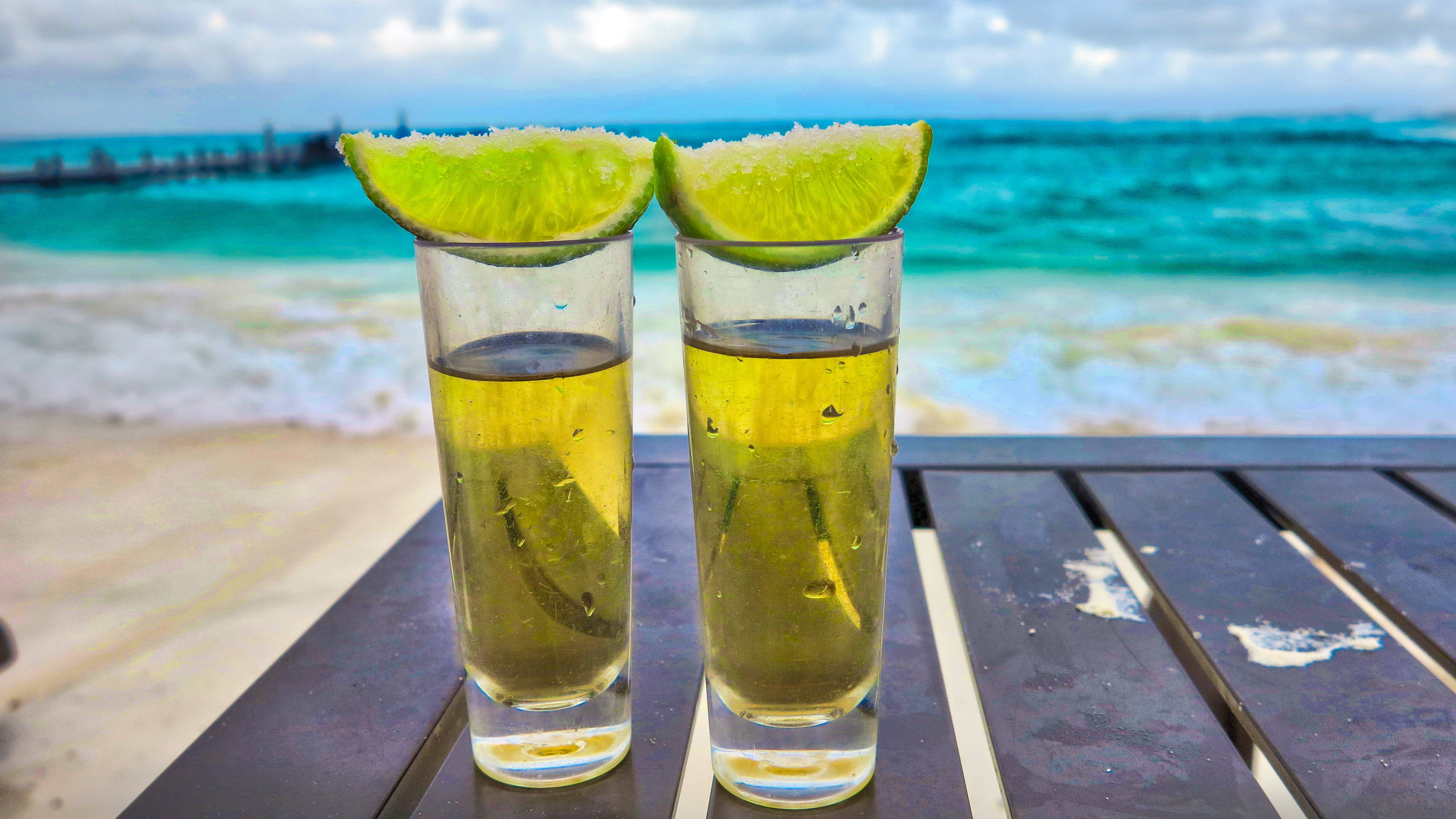 tequila shots, lime wedges, wooden table, 4K Desktop Wallpaper