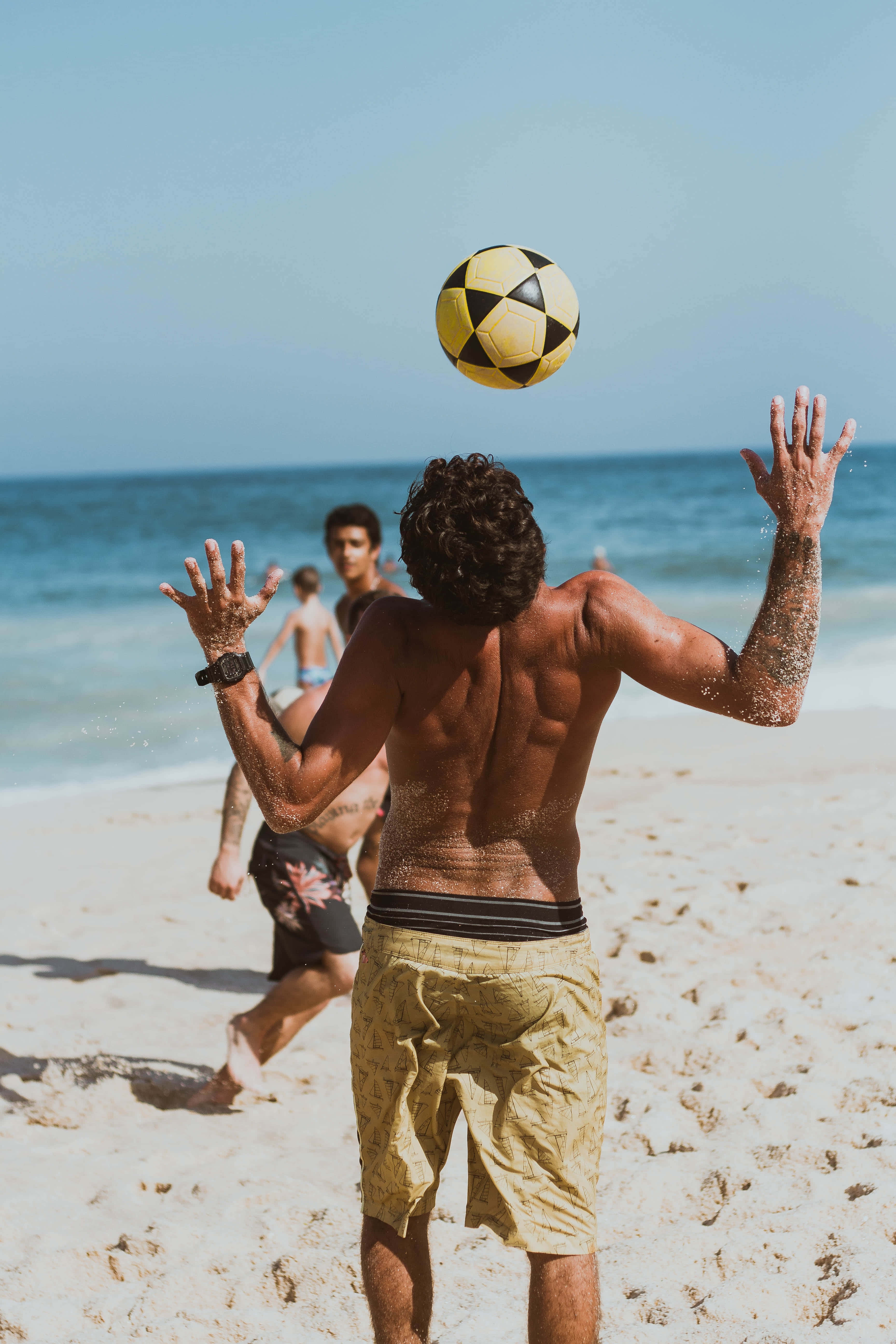 Beach Soccer, yellow and black soccer ball, sunlit beach, 5K Phone Wallpaper