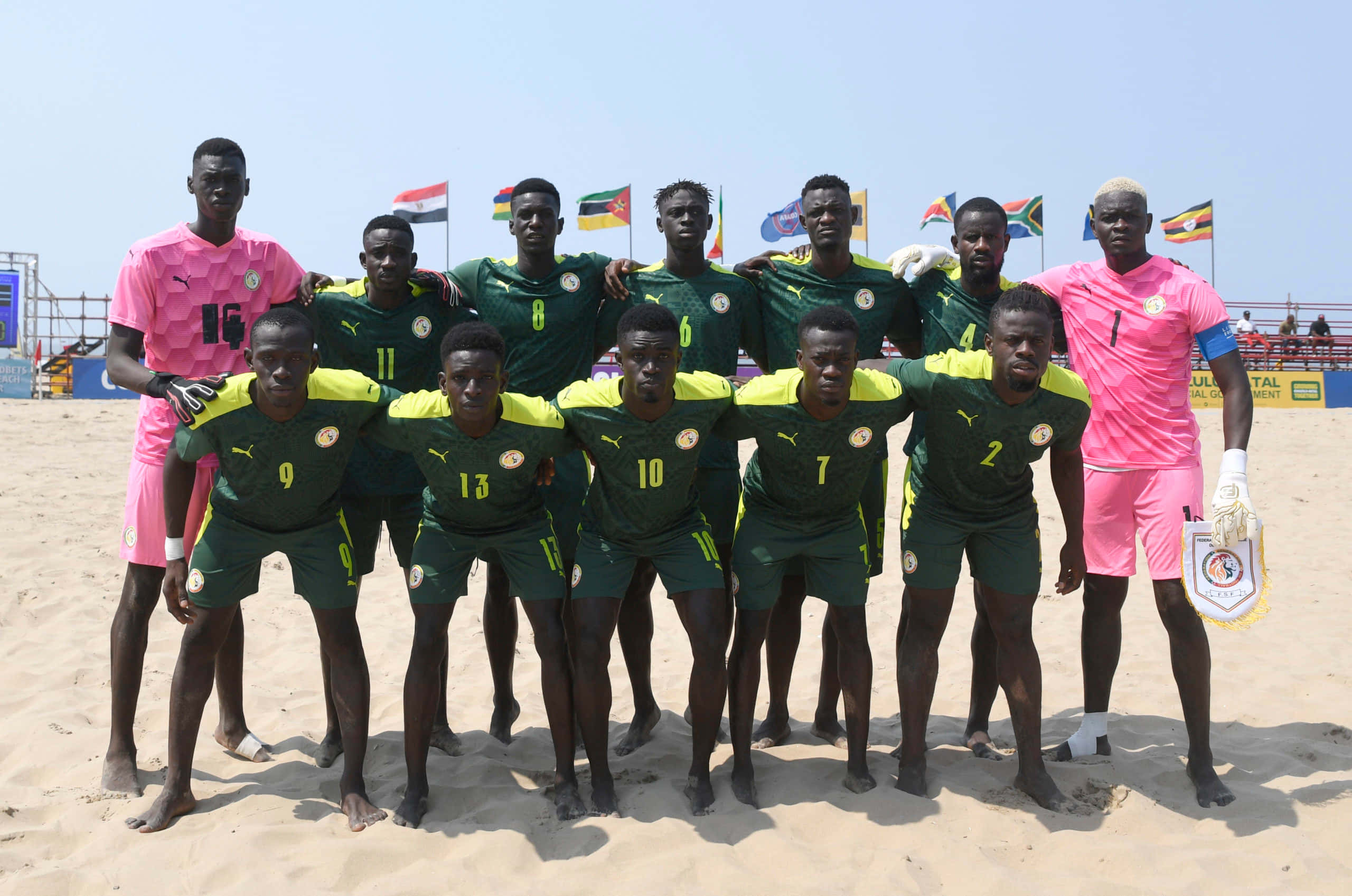 beach soccer team, green and yellow jerseys, sandy terrain, 2K Desktop Wallpaper