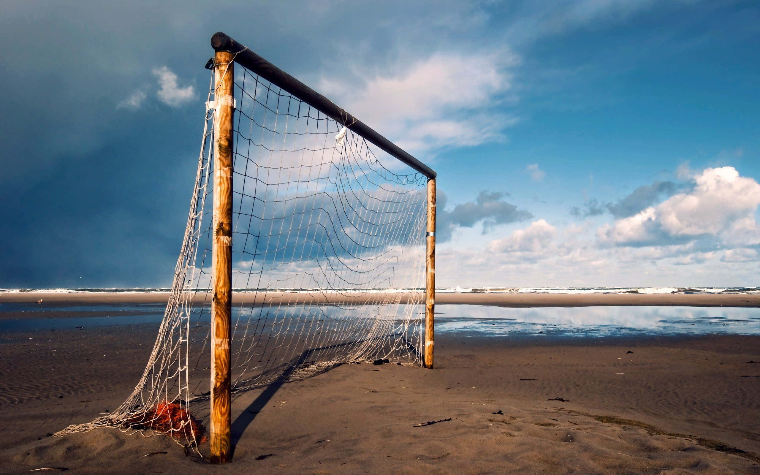 beach soccer goal post, sandy beach, dramatic blue sky, 2K Desktop Wallpaper