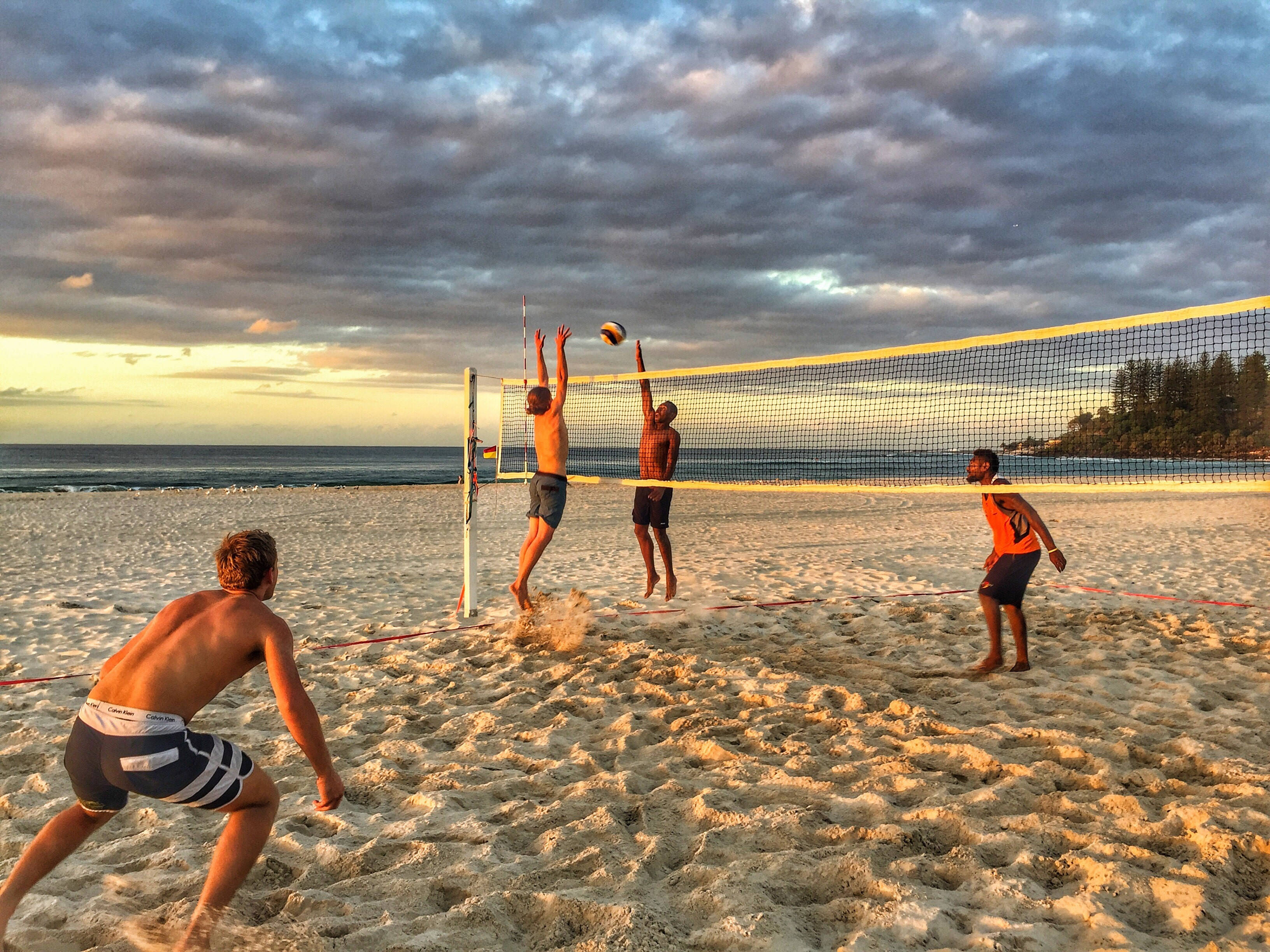 Two On Two Beach Volleyball, dramatic sunset sky, golden light, 2K Desktop Wallpaper