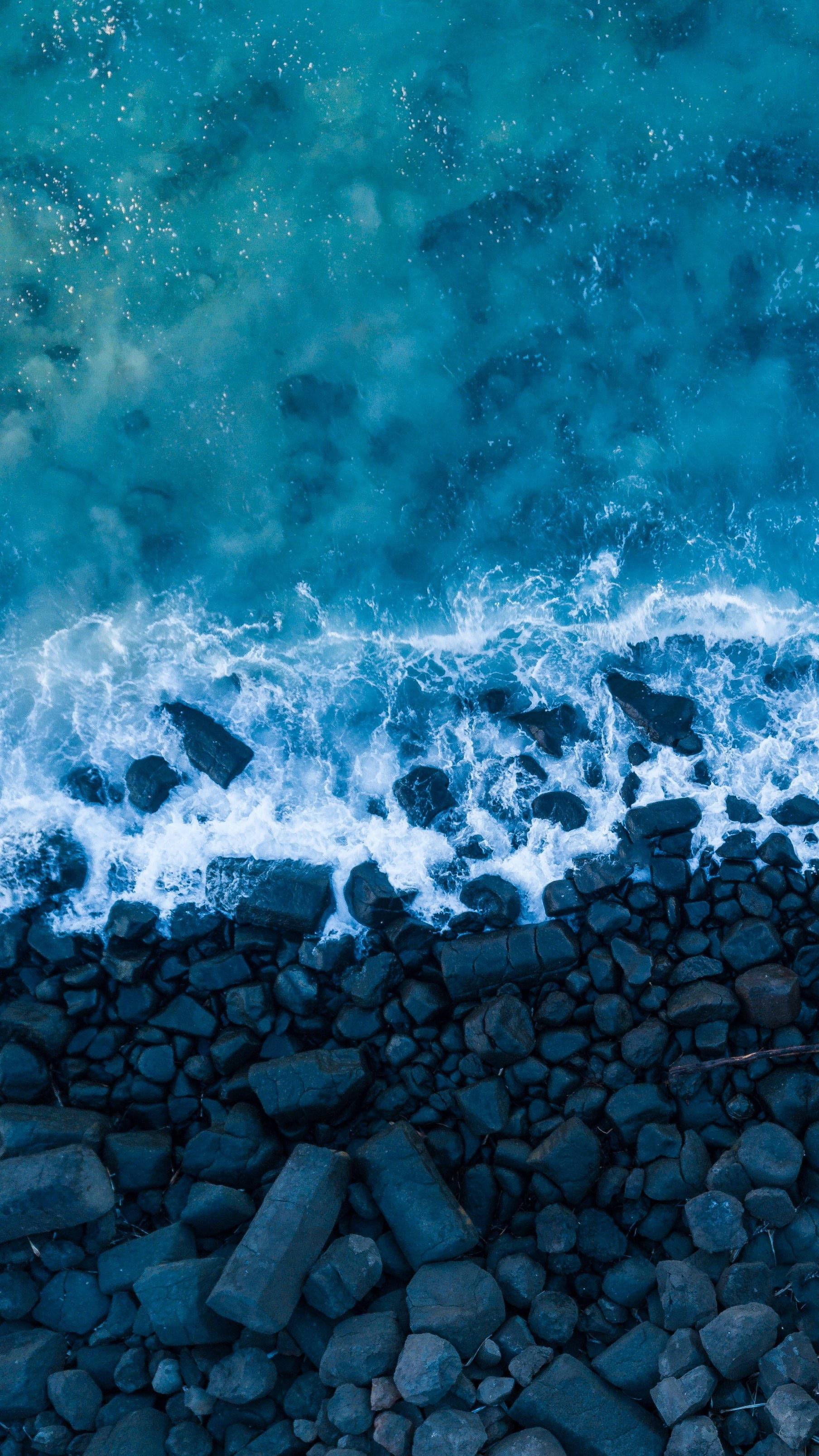 Beach Wave iPhone, turquoise ocean, dark rocky shore, 2K Phone Wallpaper