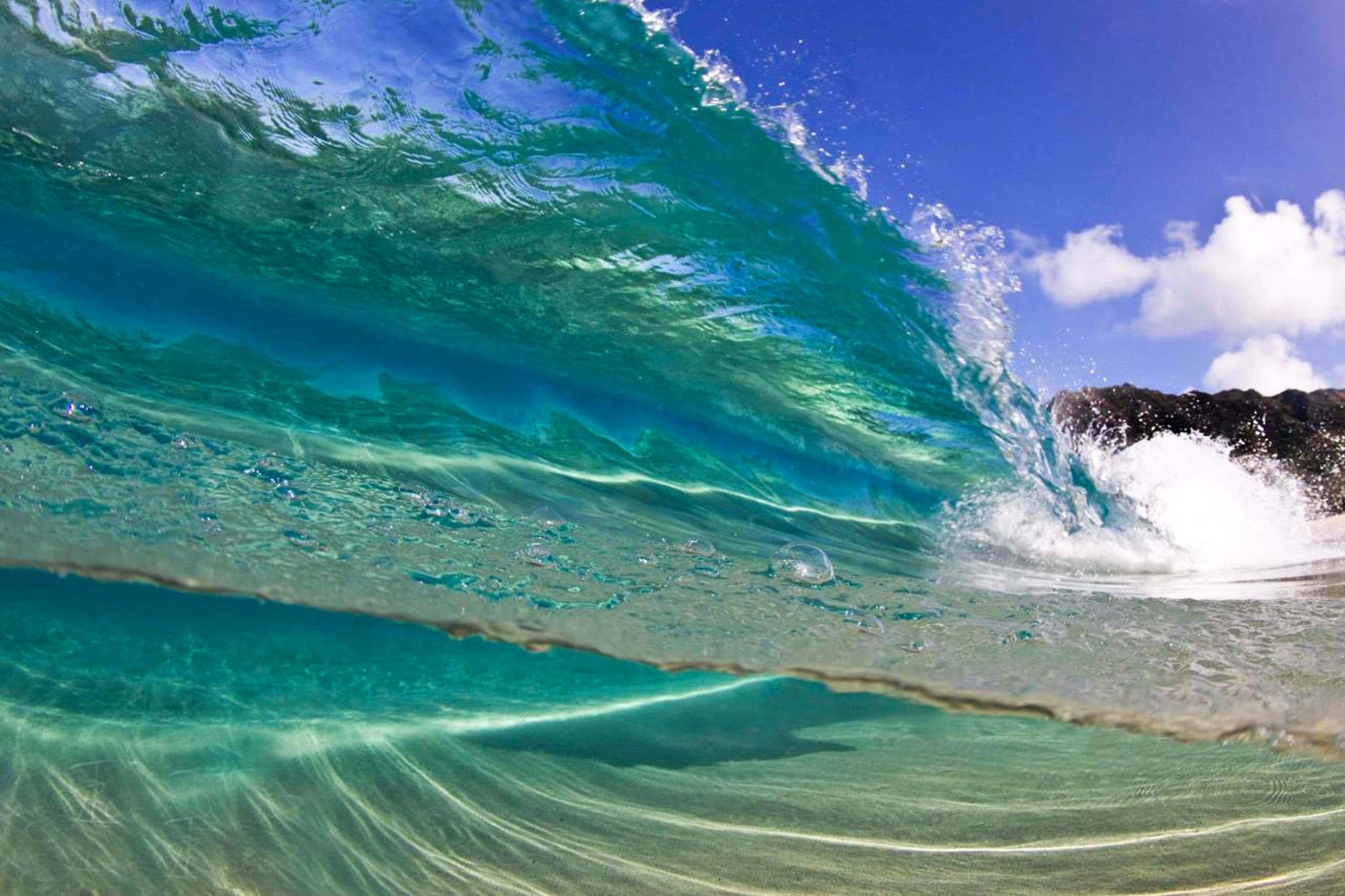 beach waves, turquoise ocean wave, dark rocks, 2K Desktop Wallpaper