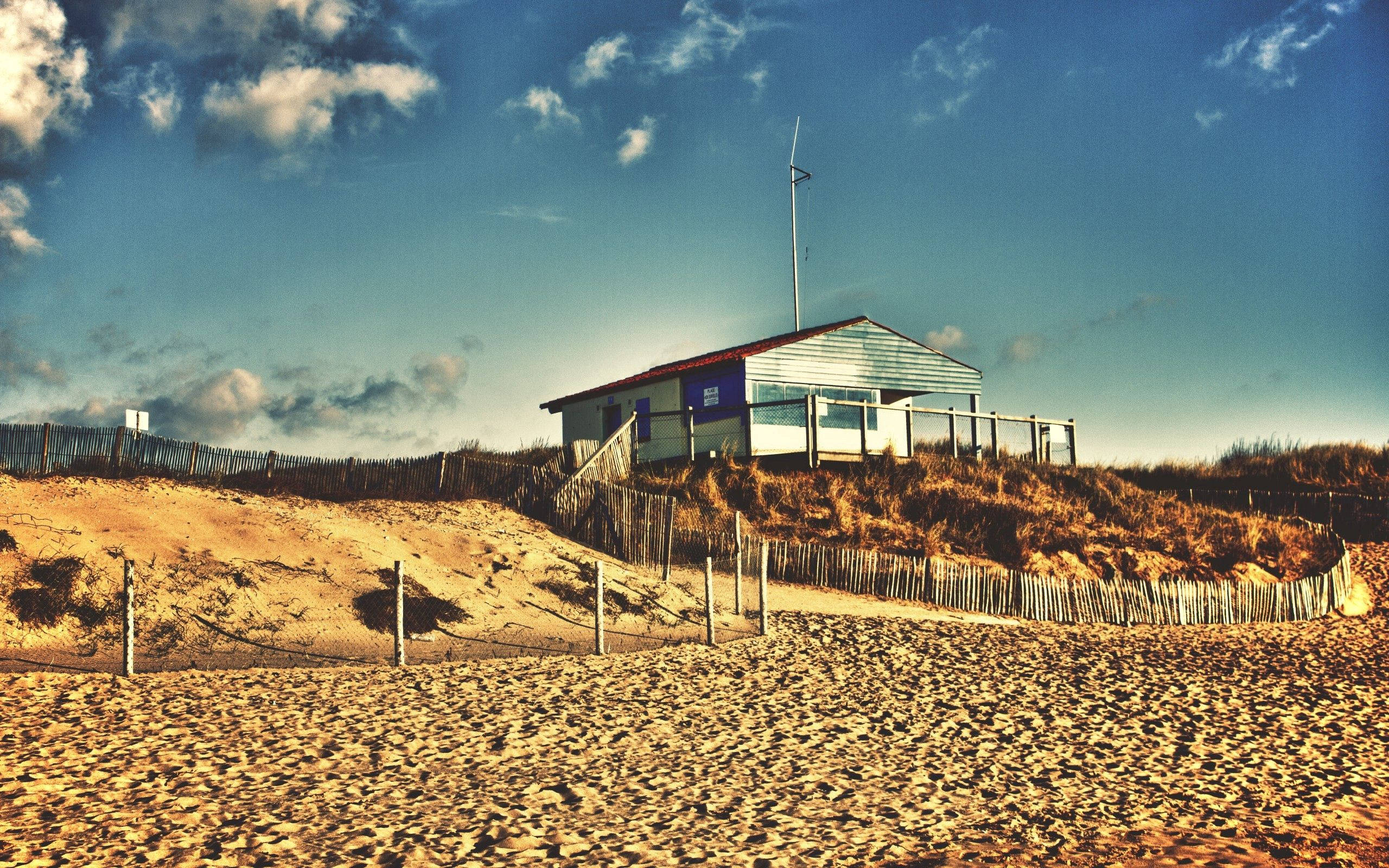 beach hut, golden dunes, vast blue sky, 2K Desktop Wallpaper