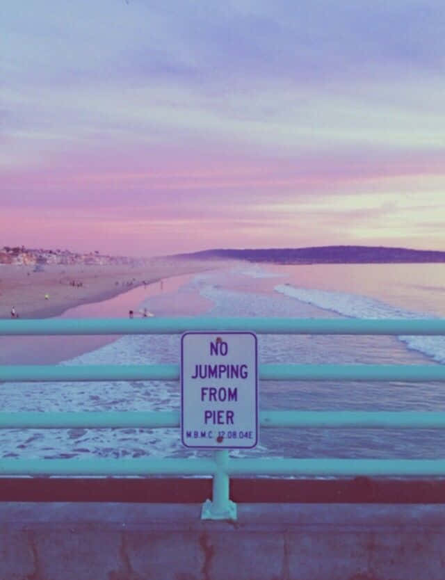 pink beach aesthetic, No Jumping sign, turquoise railing, SD Phone Wallpaper